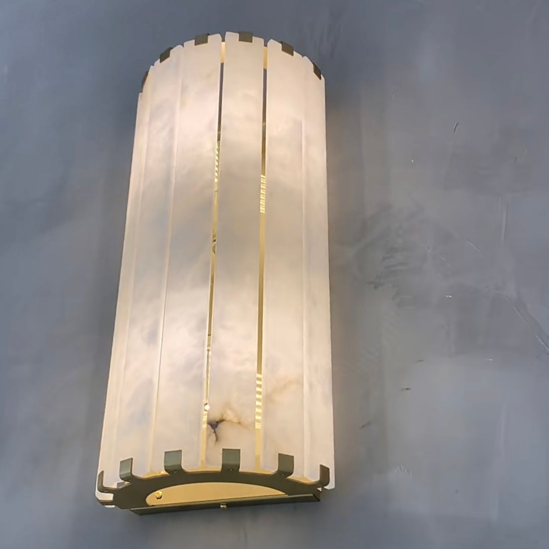 cicci marble wall light creating soft ambient lighting in luxury interior