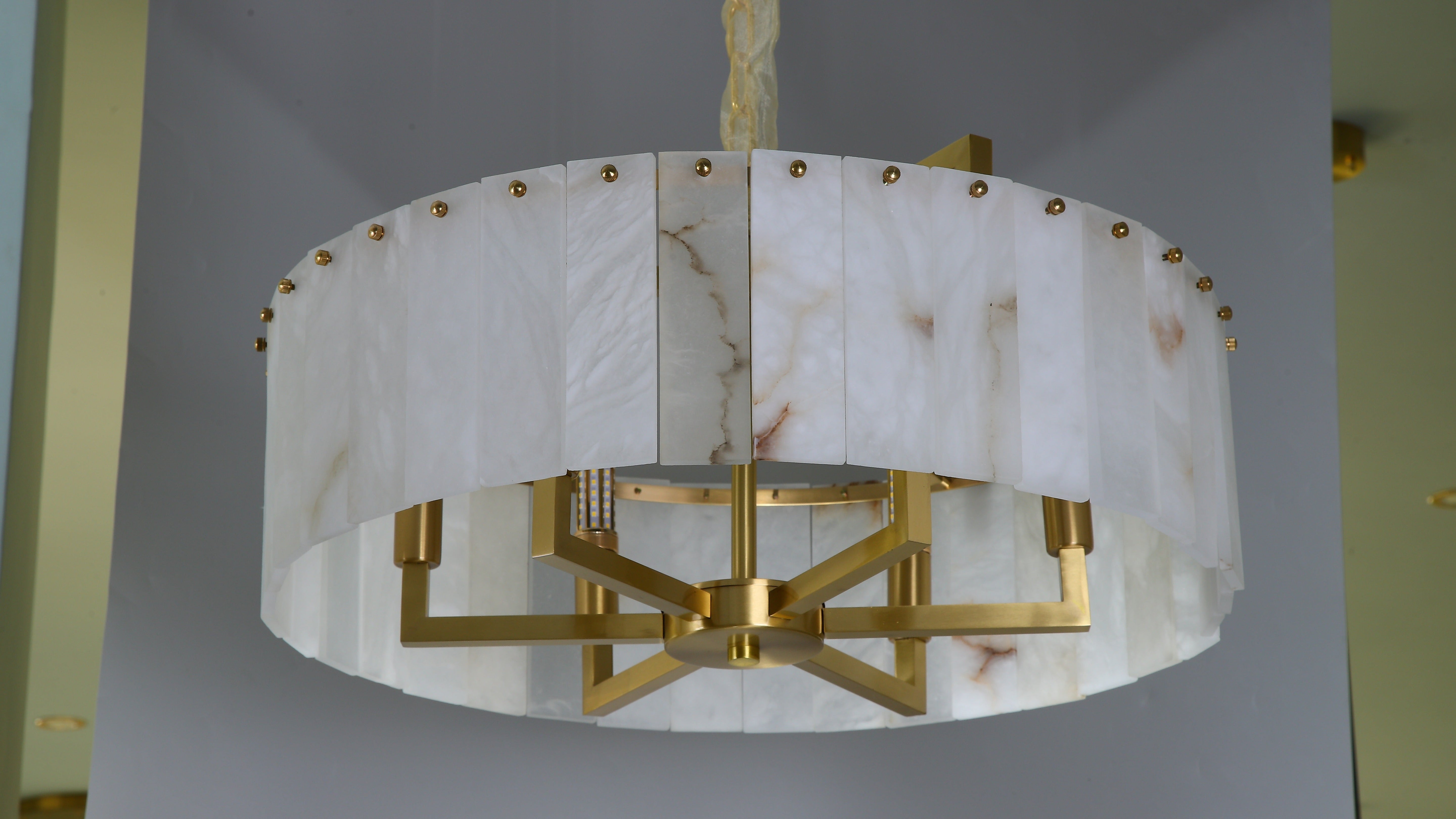 classisco chandelier close up showing marble panels and sleek circular structure