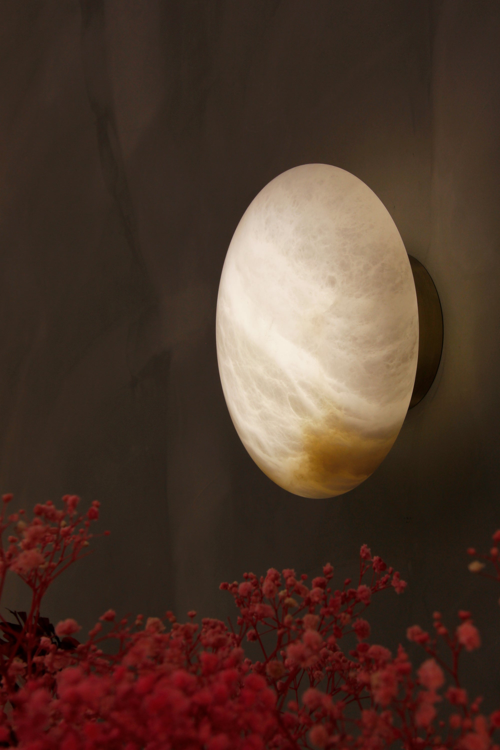como marble wall light styled in contemporary interior with soft ambient lighting