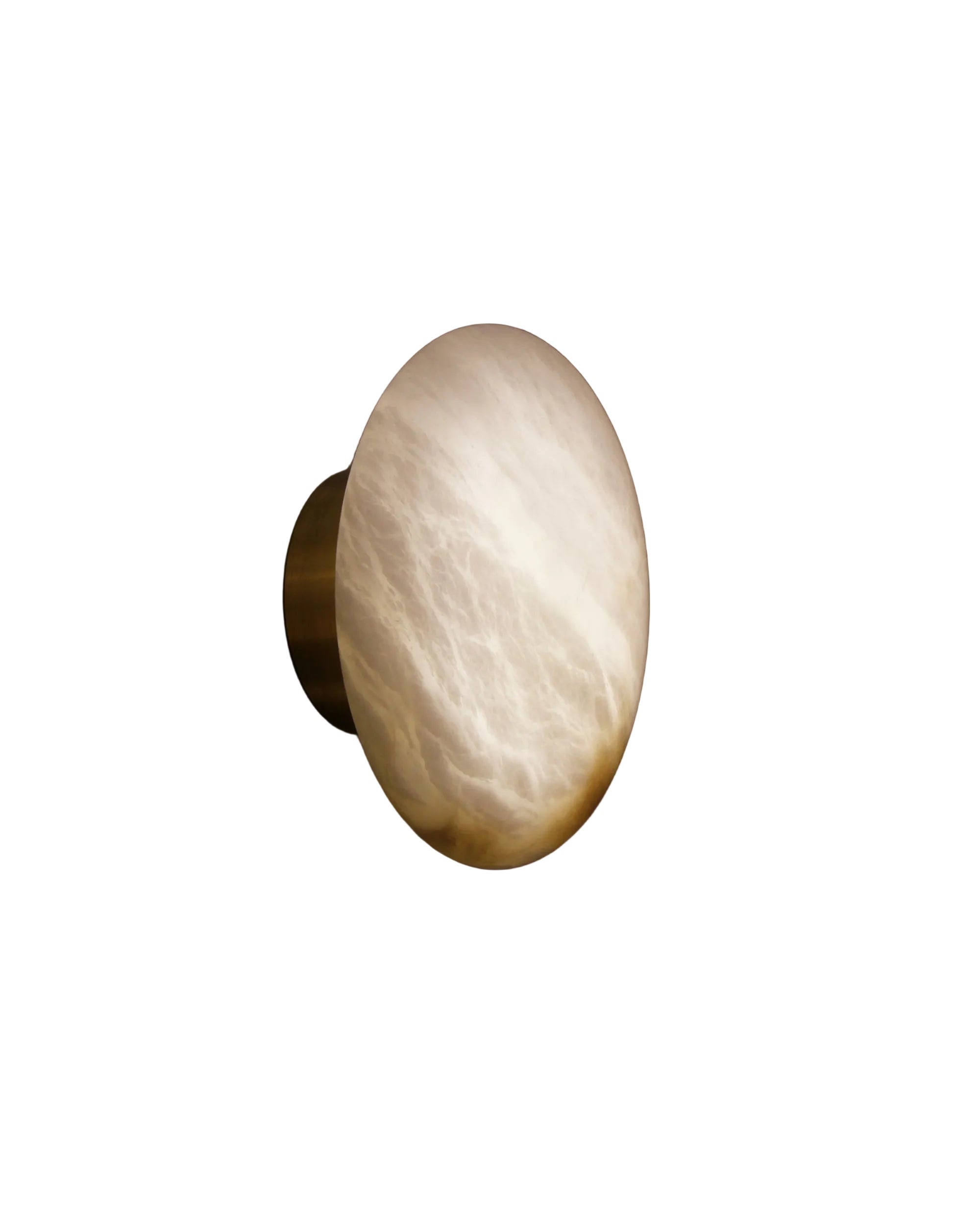 como marble wall light with circular sculptural form casting soft ambient glow