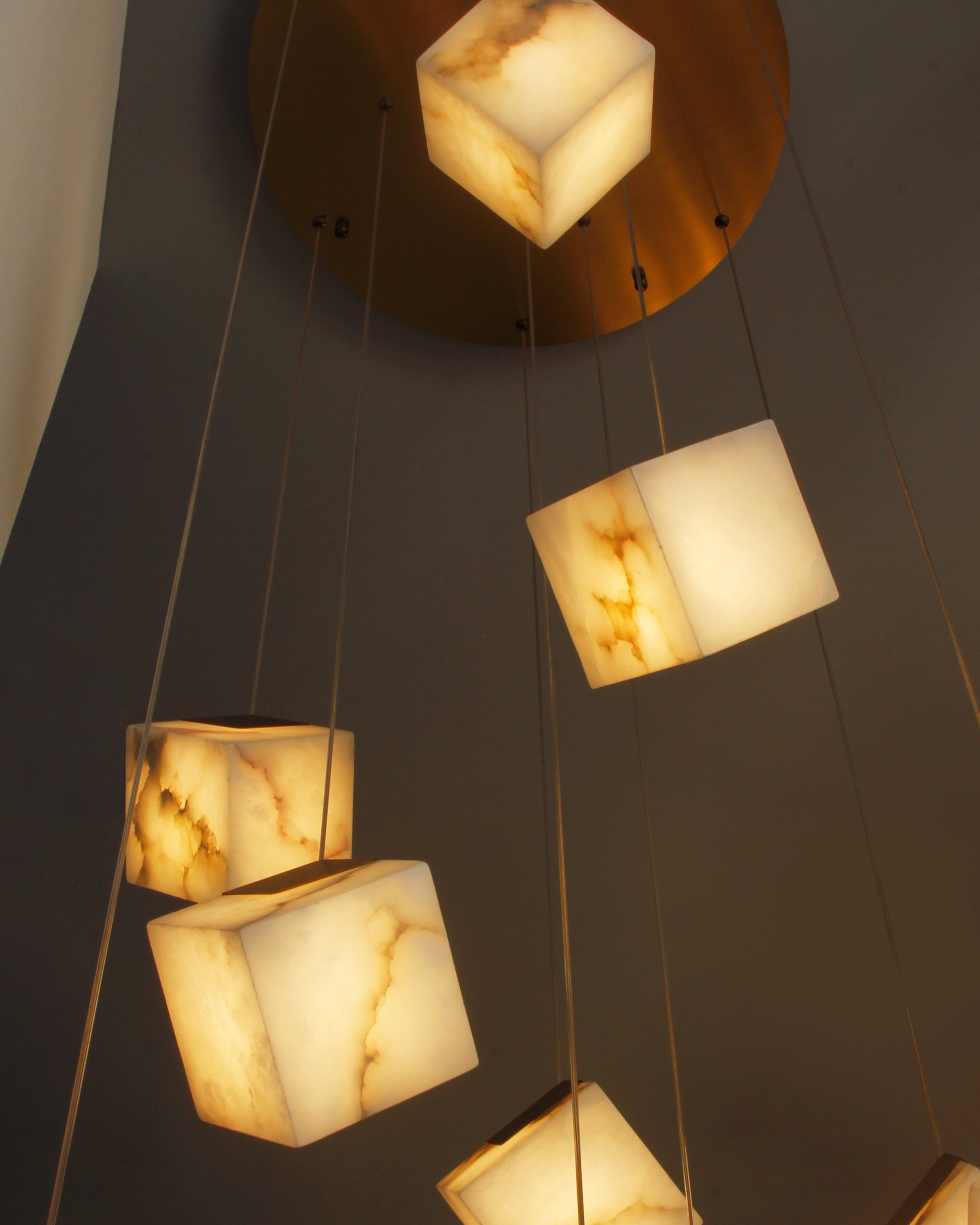 geometric alabaster cube lights suspended from circular ceiling plate