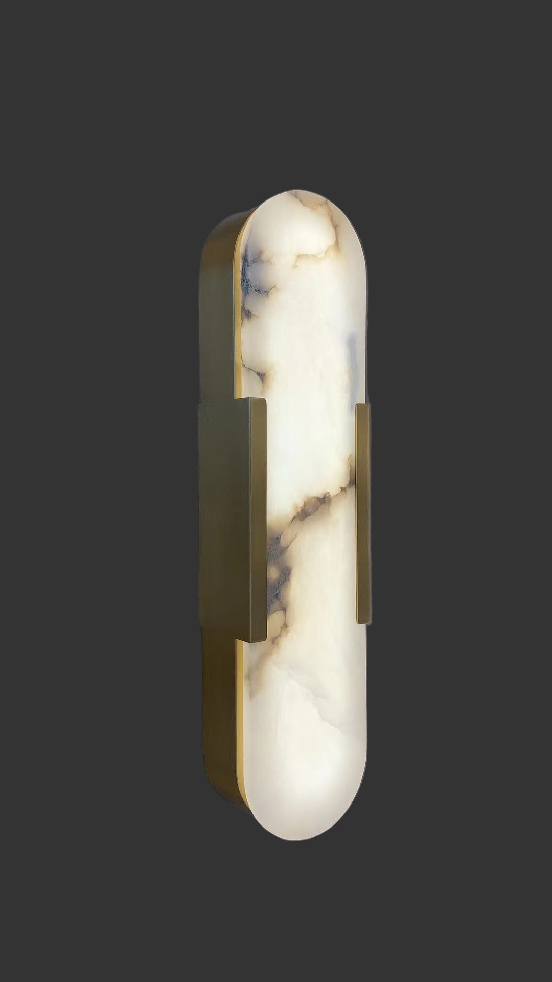 close-up of natural marble wall sconce showing refined veining and soft illumination