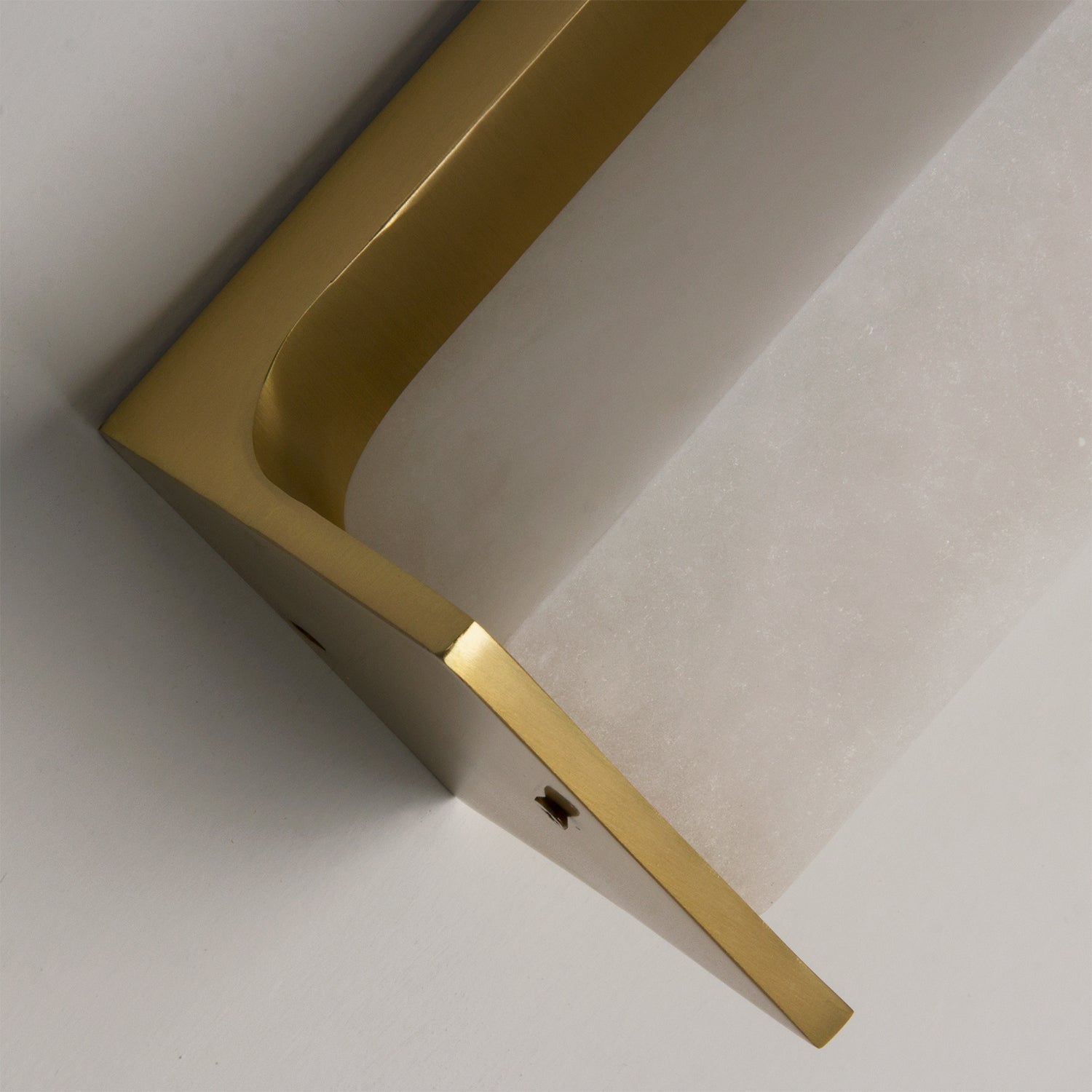Angled corner detail of the VORELLI Matera marble wall light emphasising sculptural geometry, warm tones, and contemporary Italian-inspired elegance