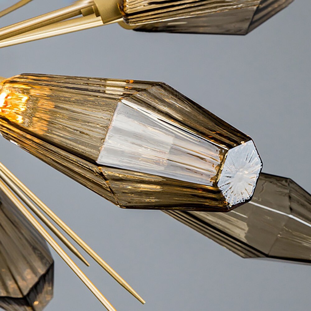 Close-up of Abdera smoky grey faceted glass with gold sculptural spikes