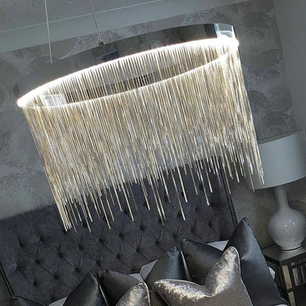 Close up of cascading illuminated chains on Adlington circular chandelier
