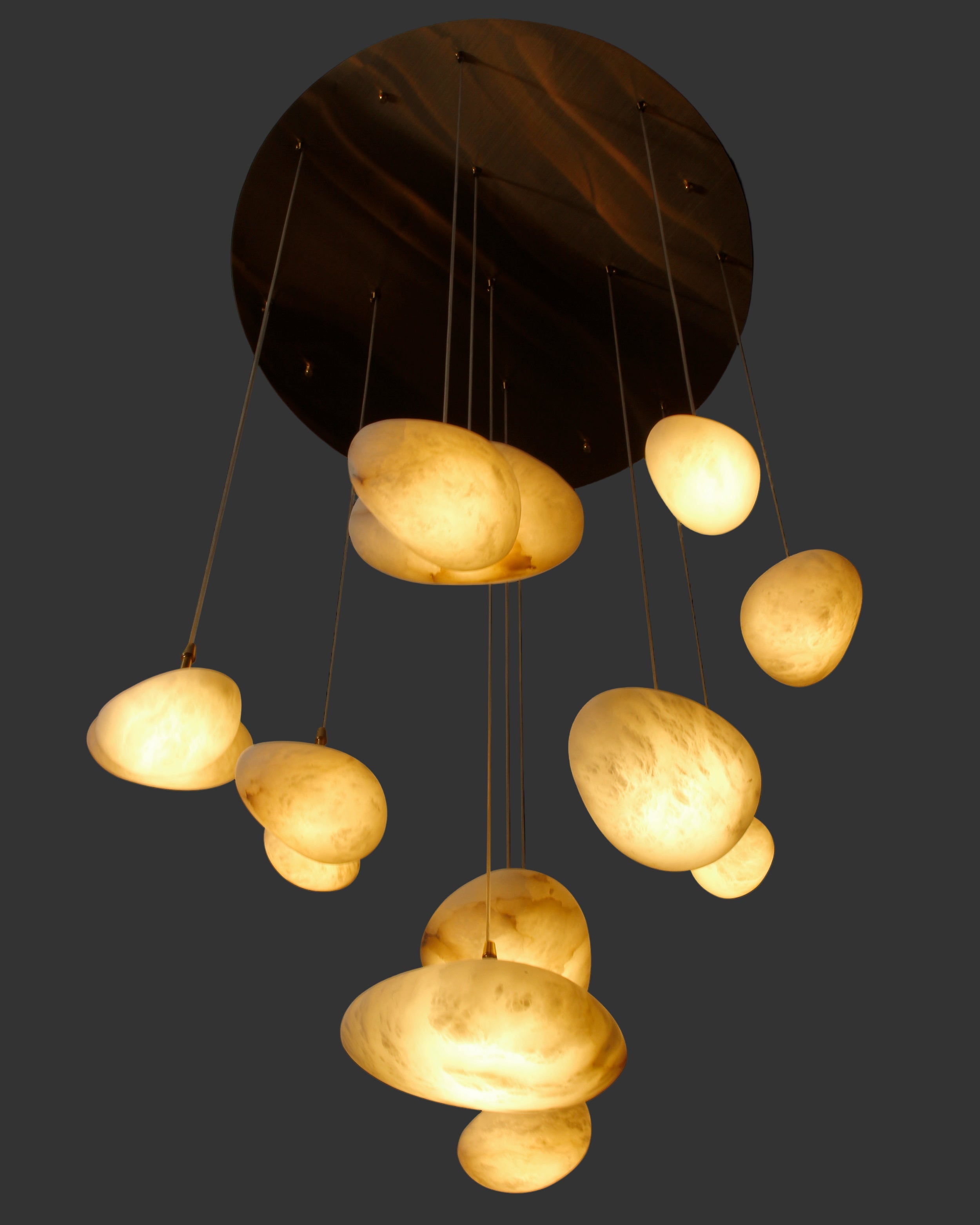 Close up of hand carved marble pendants on Alba staircase chandelier