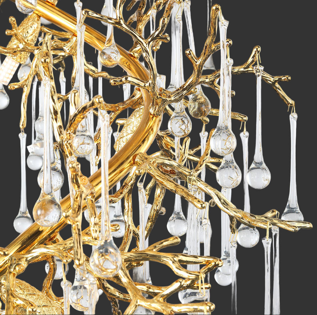 Gold branch structure with cascading glass drops on spiral staircase chandelier