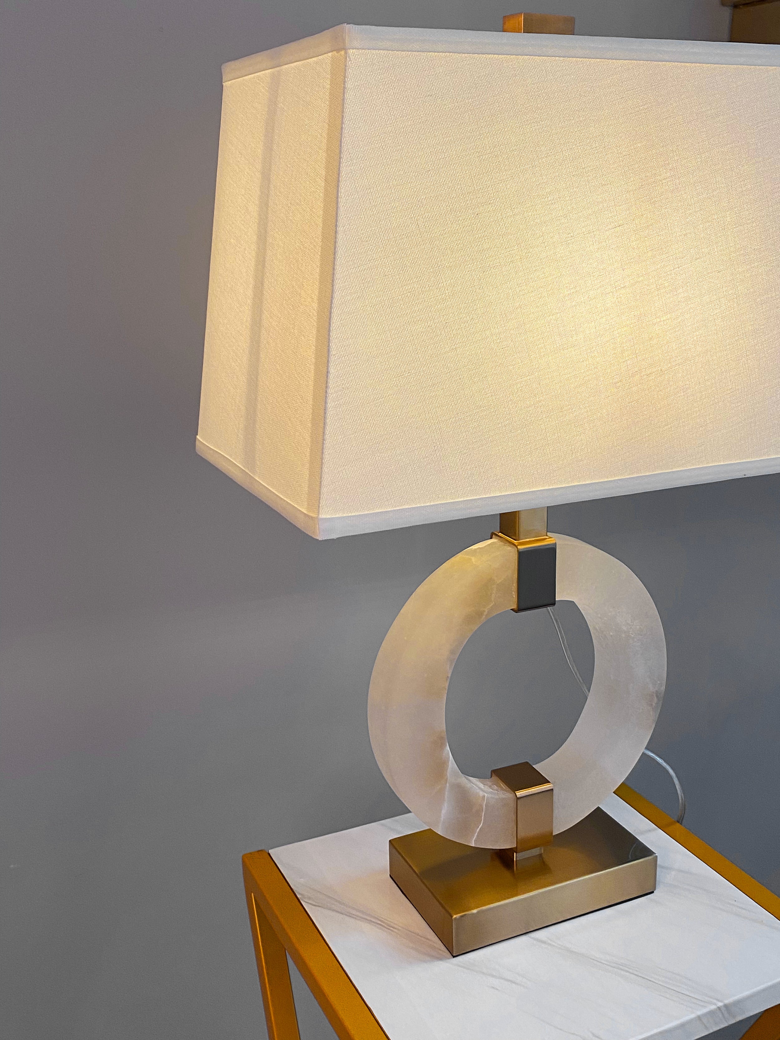 Anello Marble Table Lamp styled on bedside table in luxury interior