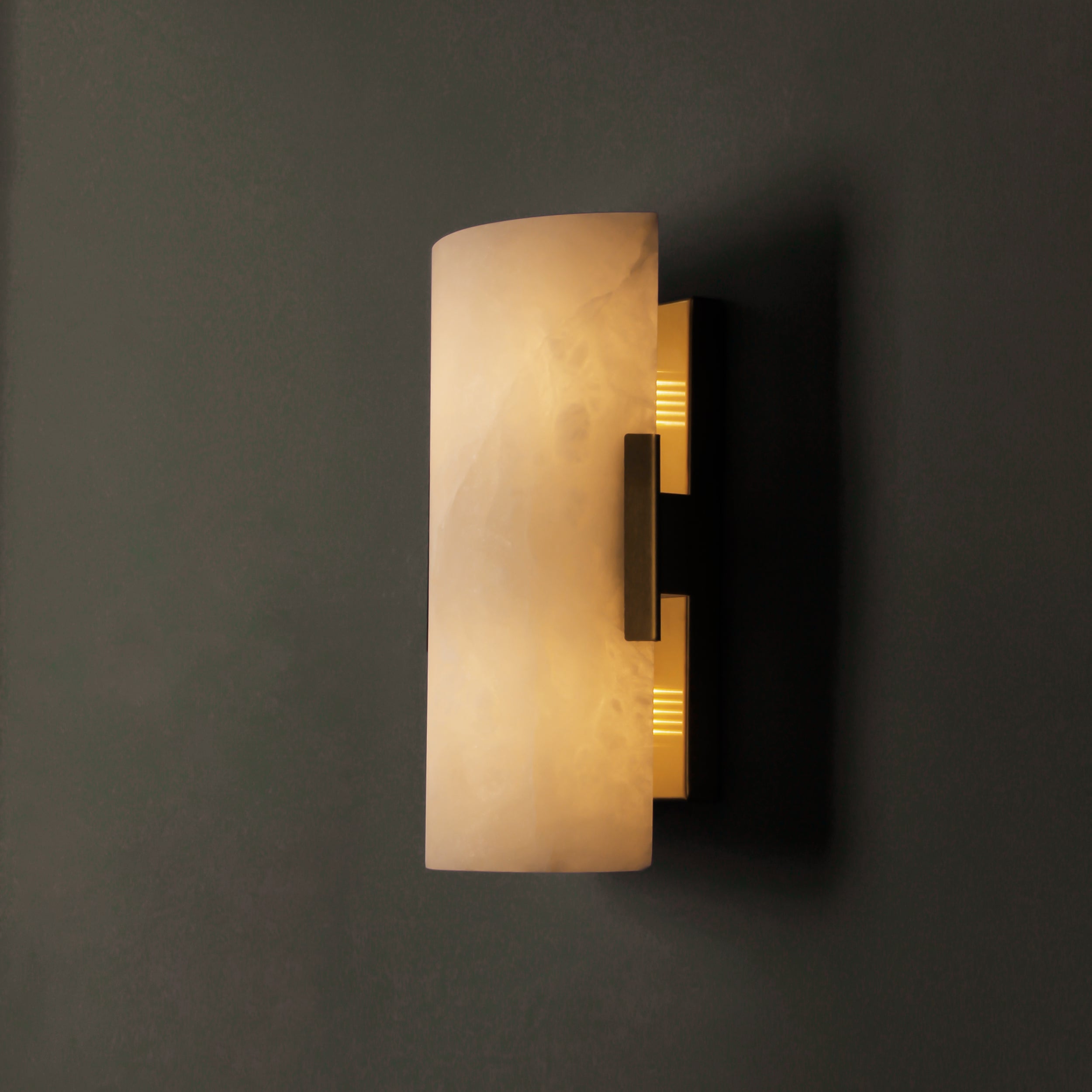 Arco Marble Wall Light showing warm ambient glow on wall
