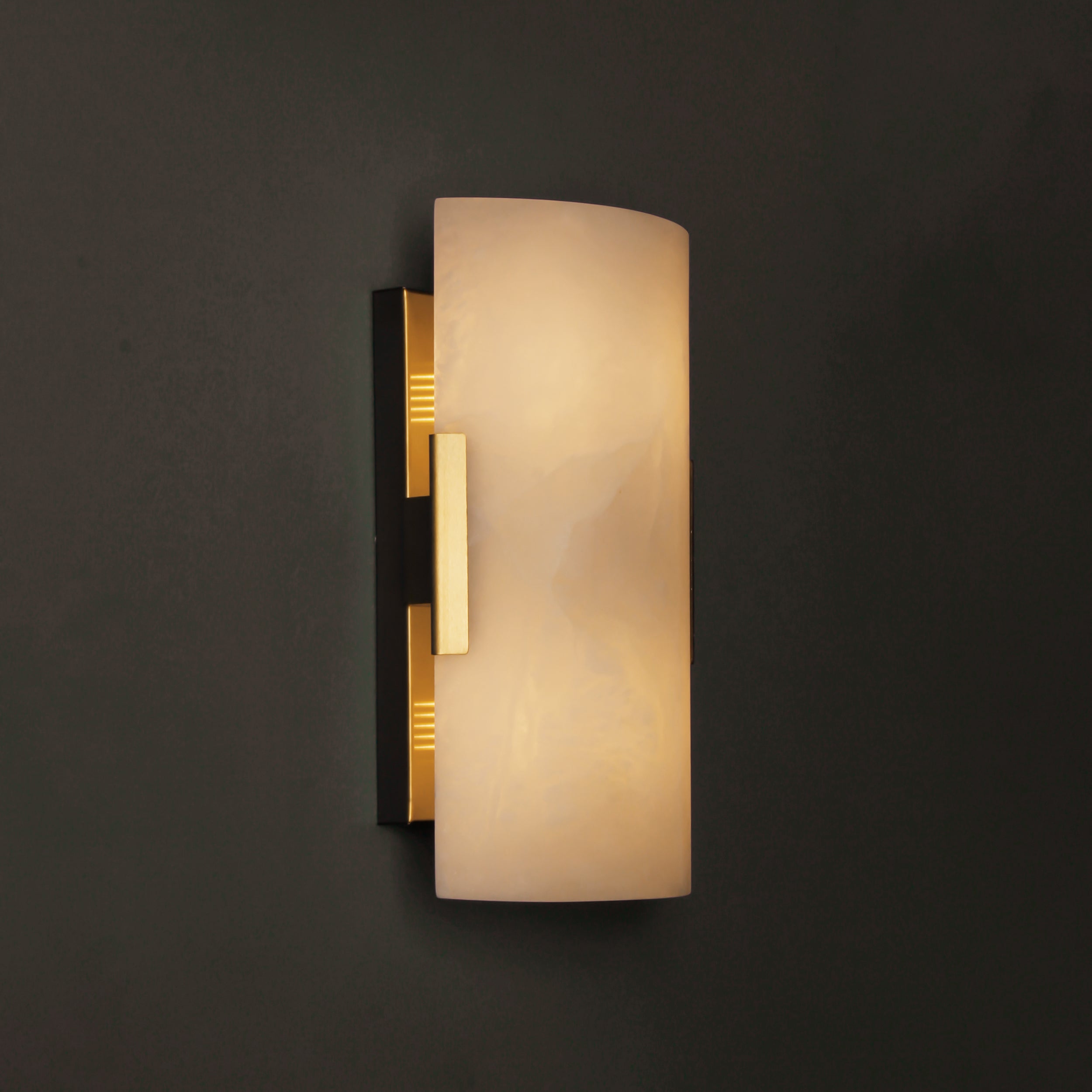 Front view of Arco Marble Wall Light installed on dark wall