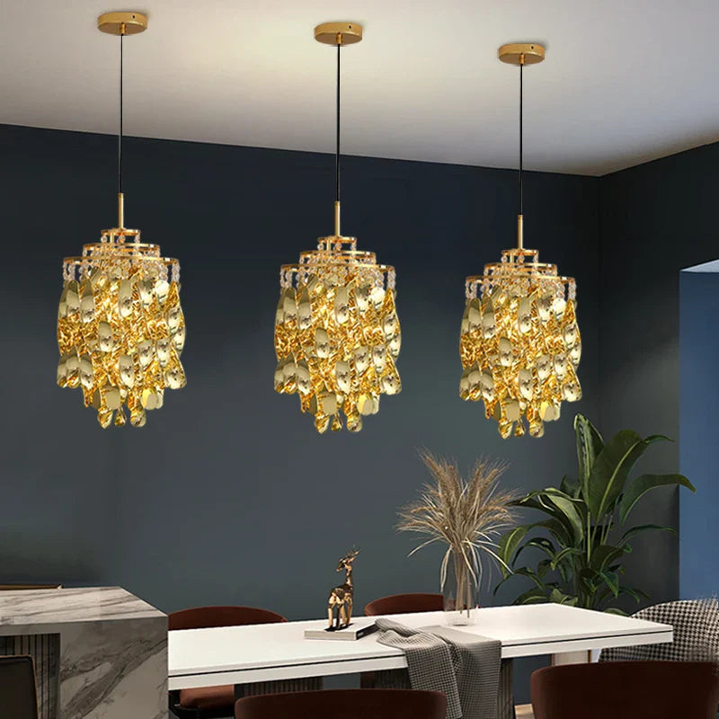 Arezzo Pendant Light in gold finish above dining table