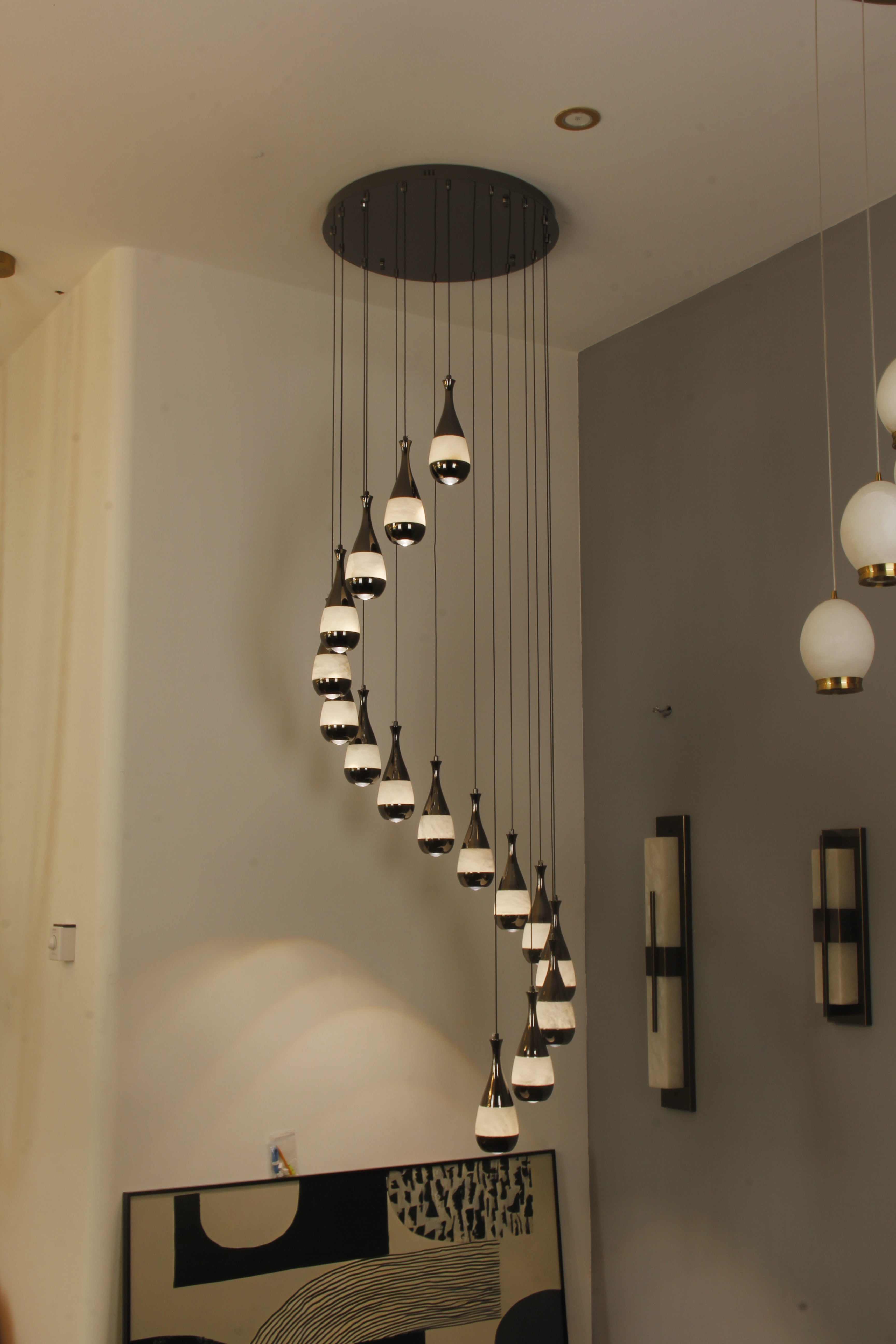 Armonia marble chandelier in double height staircase setting