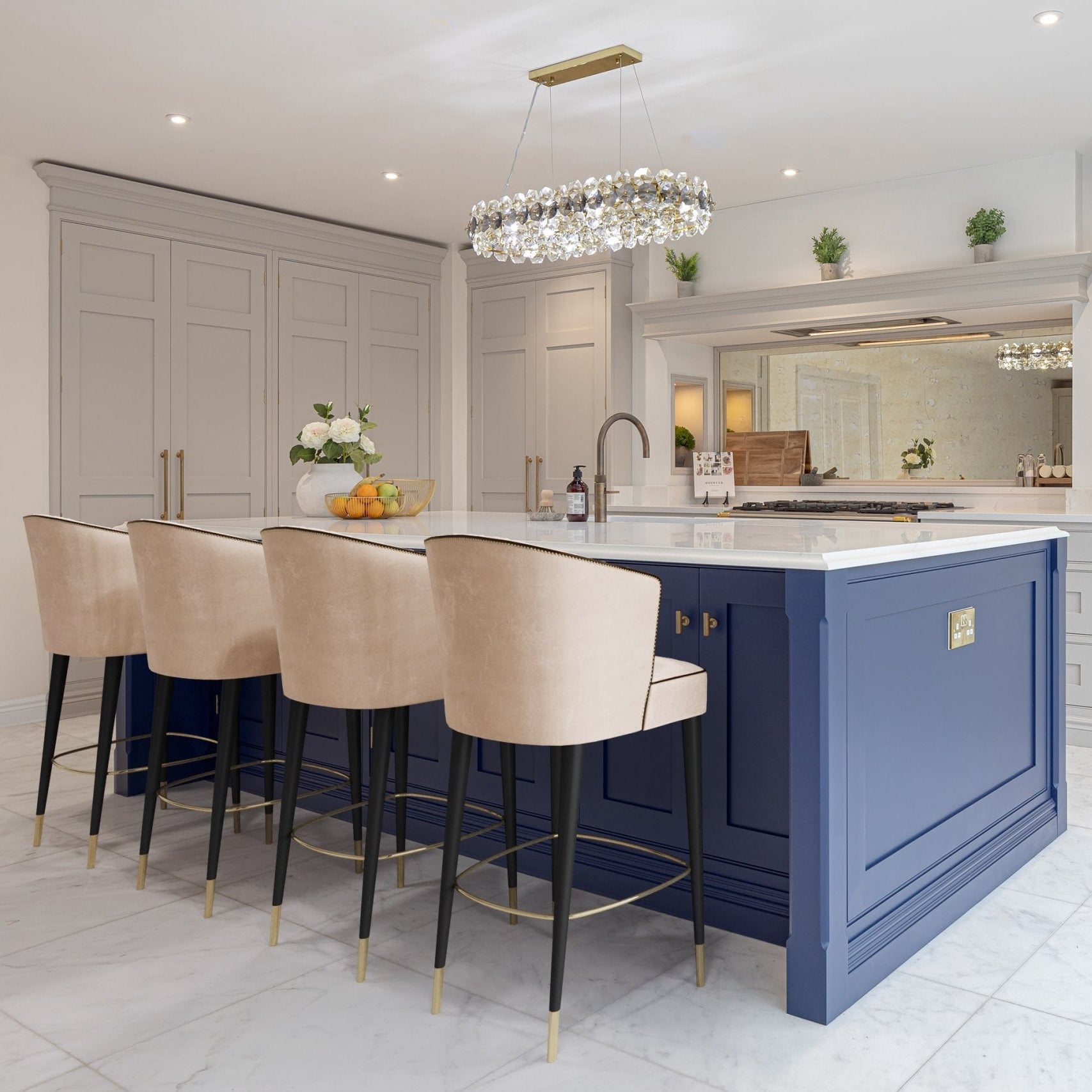 Astoria rectangular chandelier installed above kitchen island