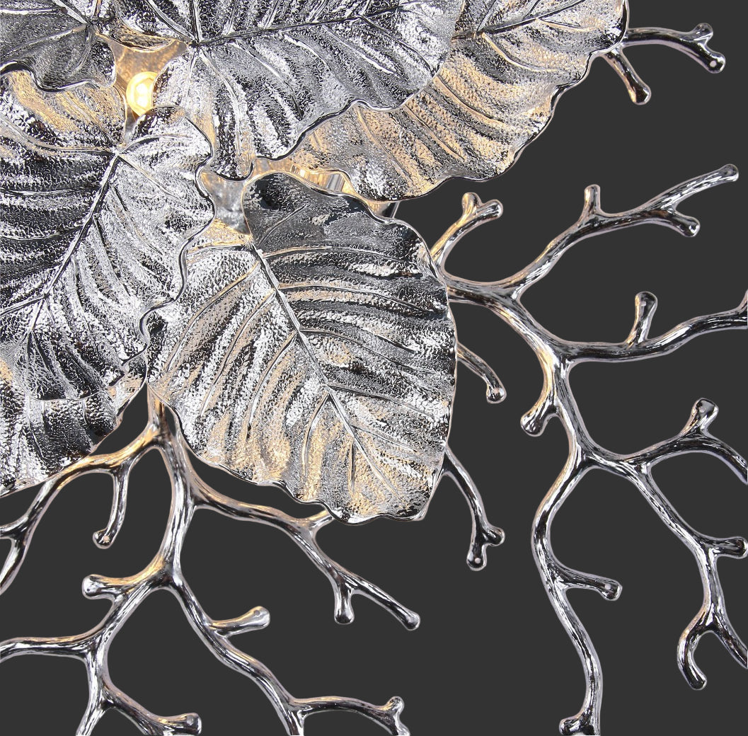 Close-up of Aurelia Wall Light II showing textured sculptural glass leaves