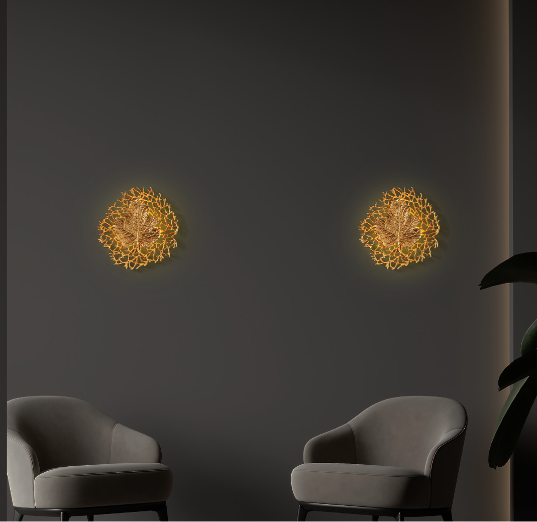 Aurelia sculptural leaf wall light illuminated in luxury interior setting