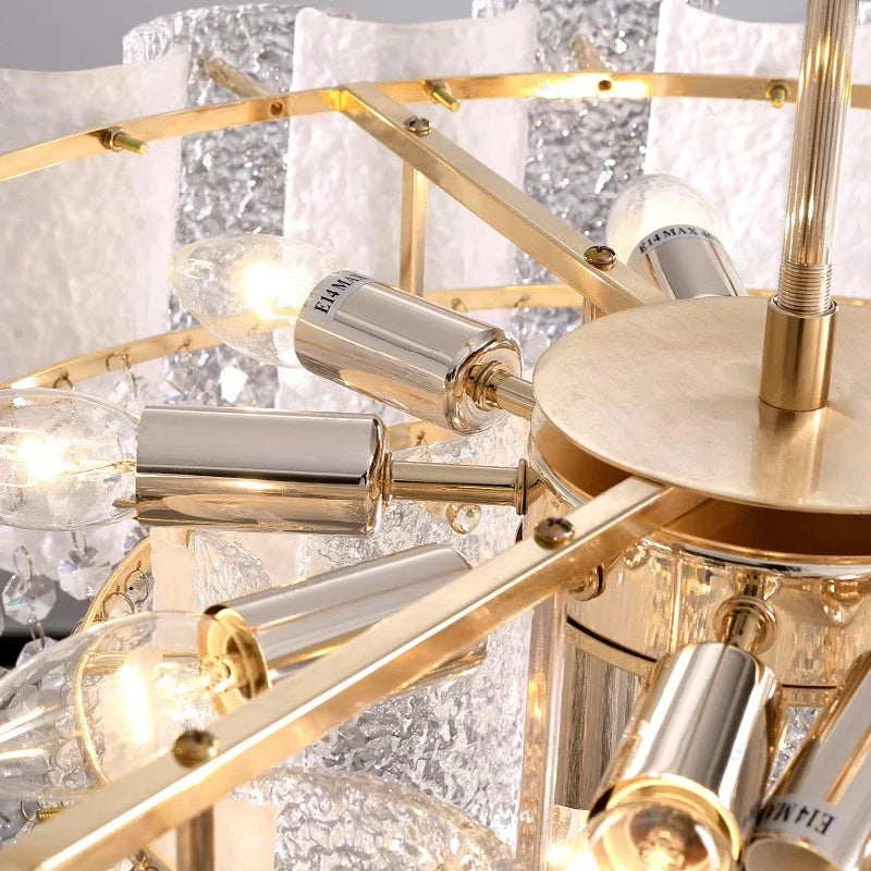 Detail of cascading crystal strands and gold frame on Avino chandelier