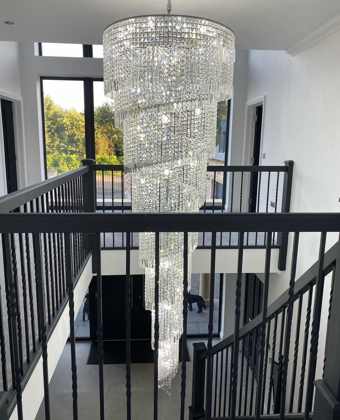 Angled view of cascading Basiglio spiral crystal chandelier