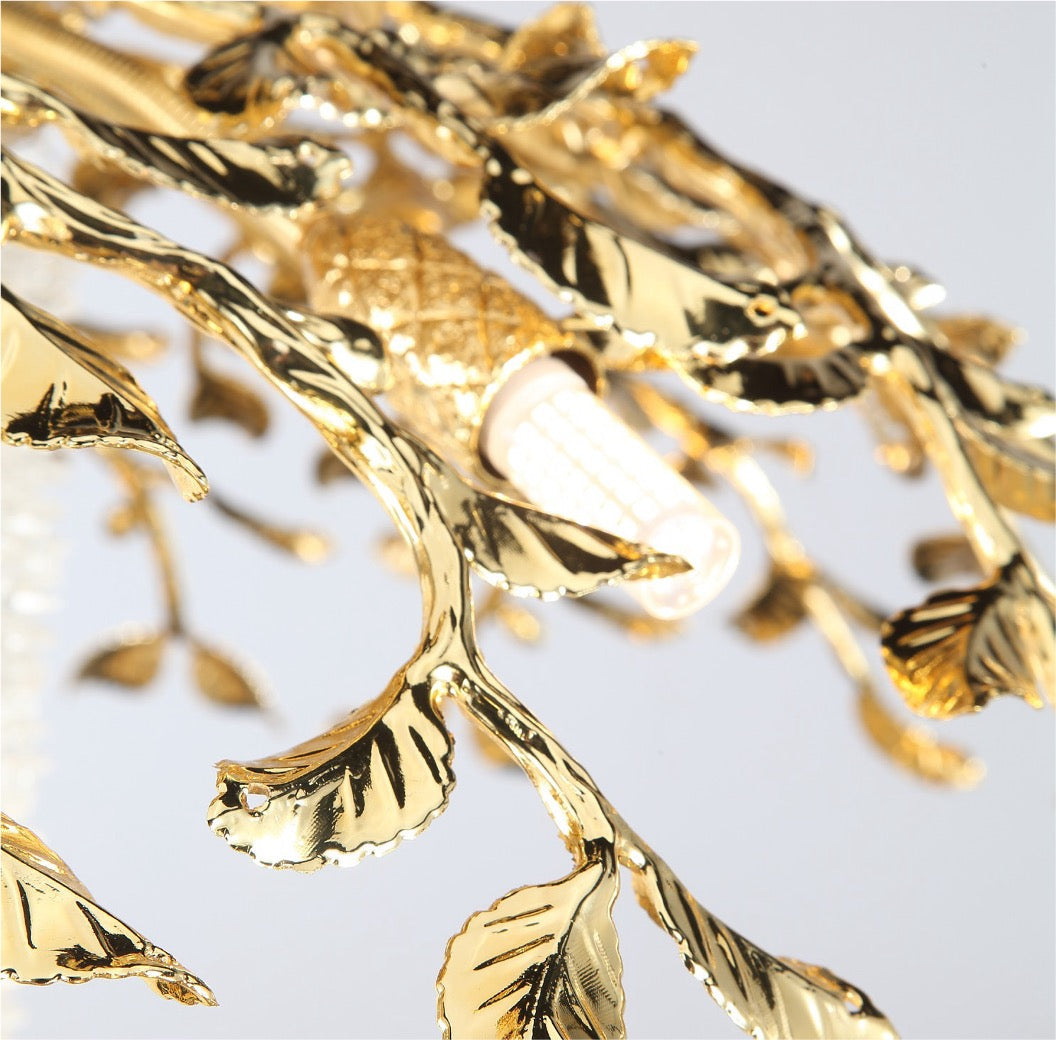 Close-up of sculpted gold leaf detailing on Bellarosa pendant light