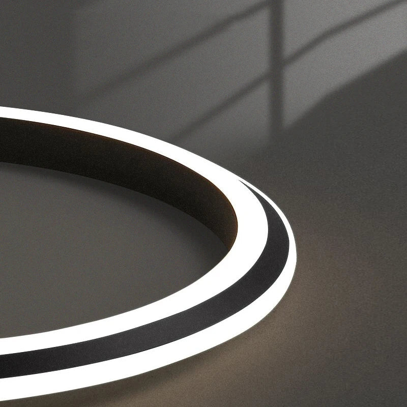 Warm white LED illumination detail of Bellezza Trio circular chandelier
