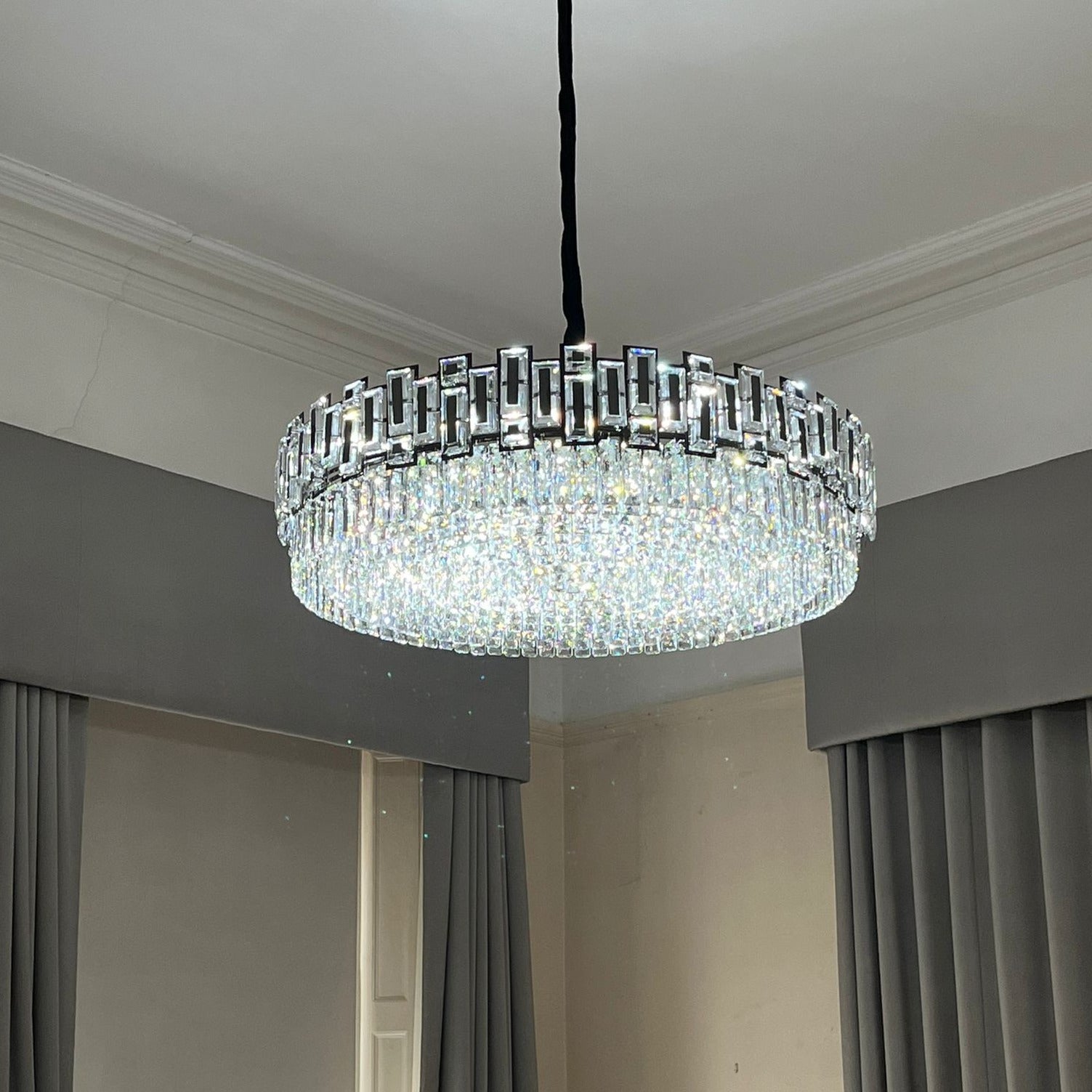 Lit Belvedere crystal ring chandelier with even light diffusion