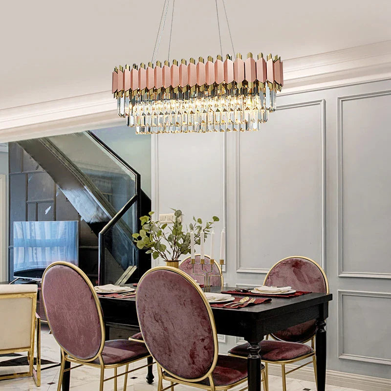 Bianca rose gold rectangular chandelier installed above dining table
