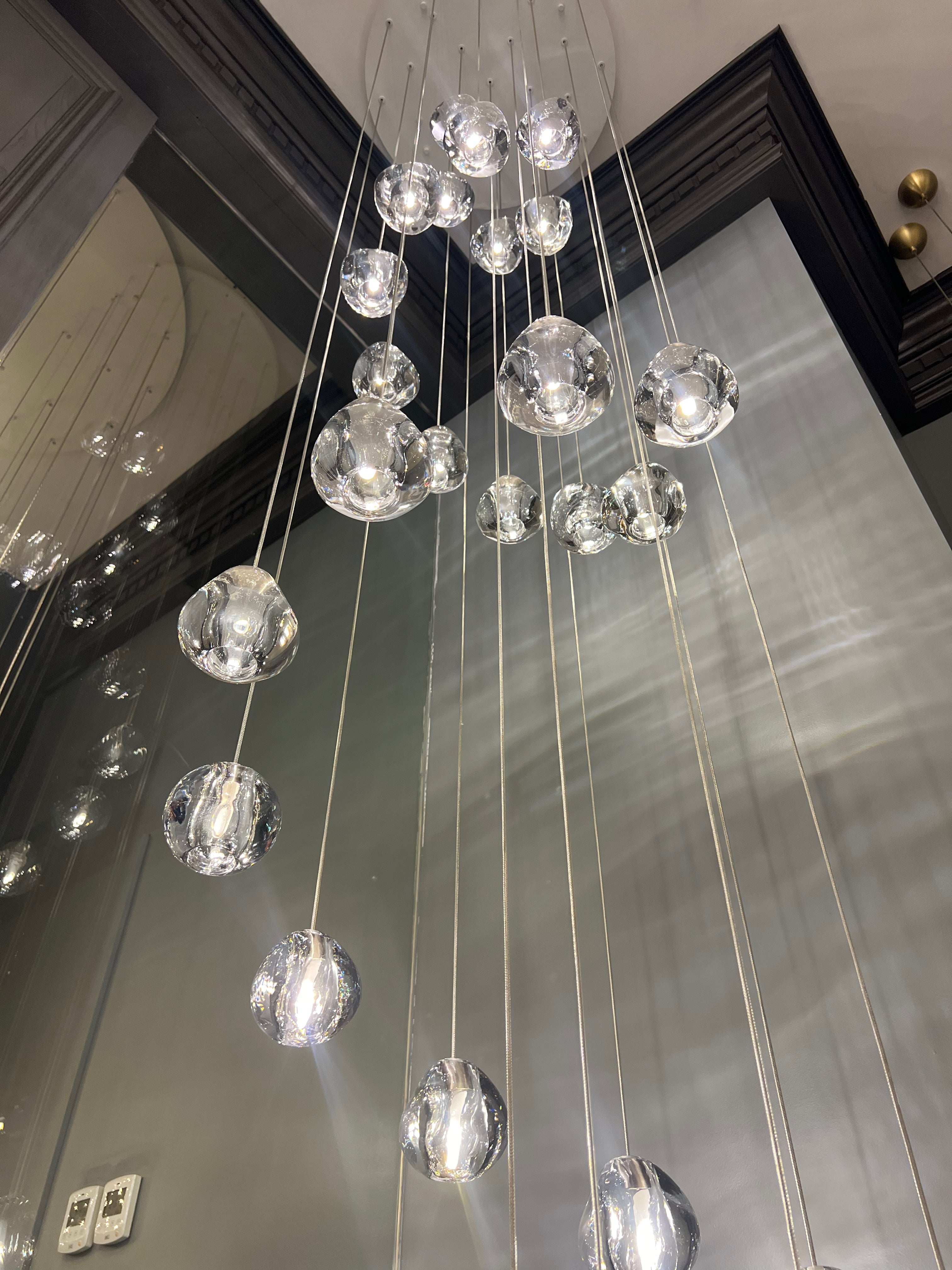 Close-up of artistic glass sphere pendant on Biella chandelier