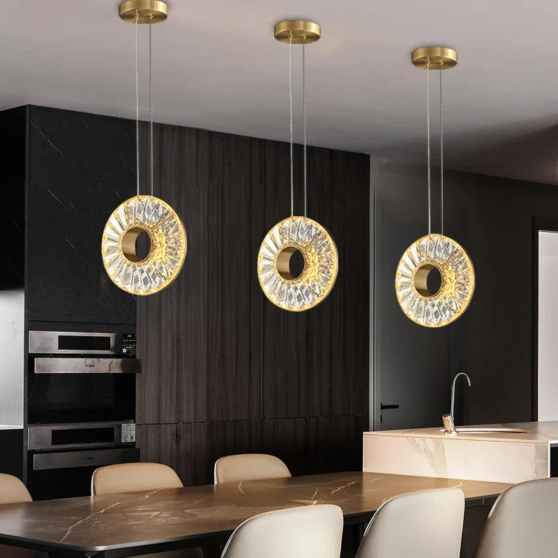 Bocelli crystal ring pendants installed above modern kitchen island