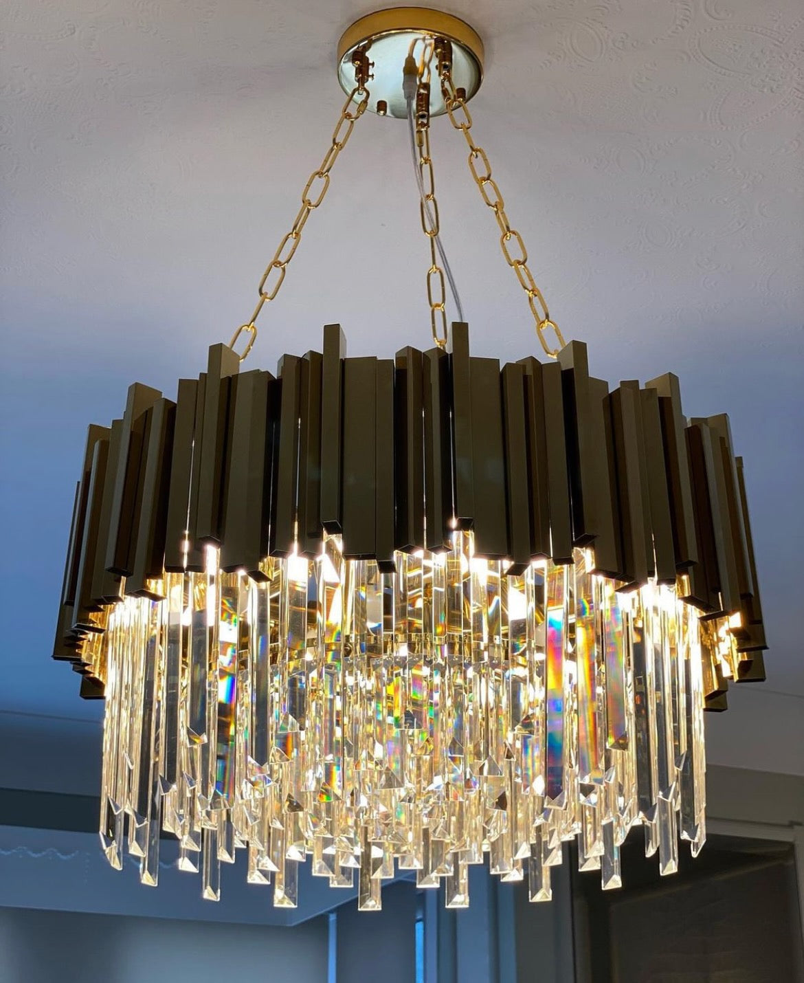Boeotia crystal circular chandelier illuminating modern home interior
