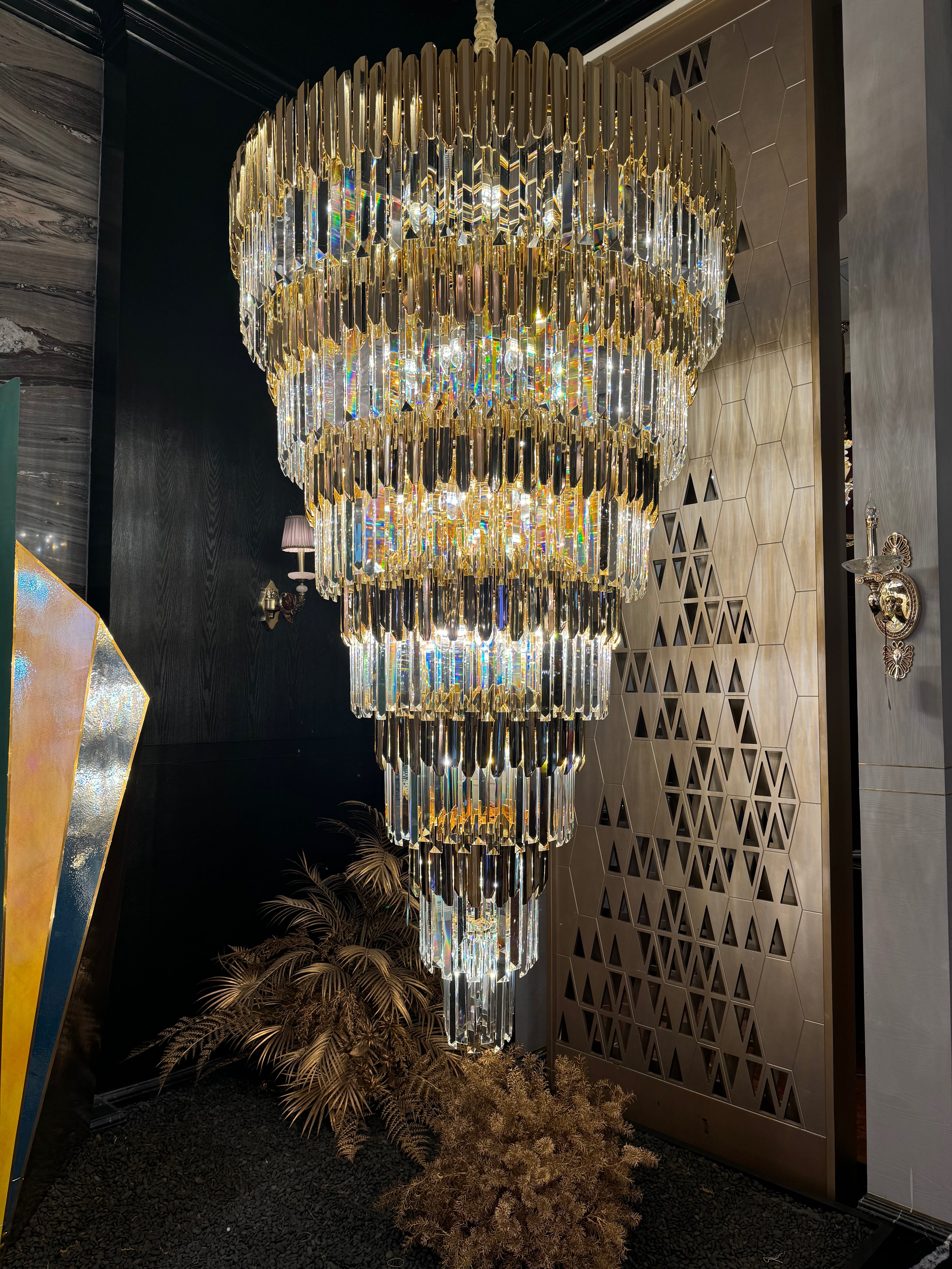 Boeotia Grandeur chandelier creating statement lighting in staircase