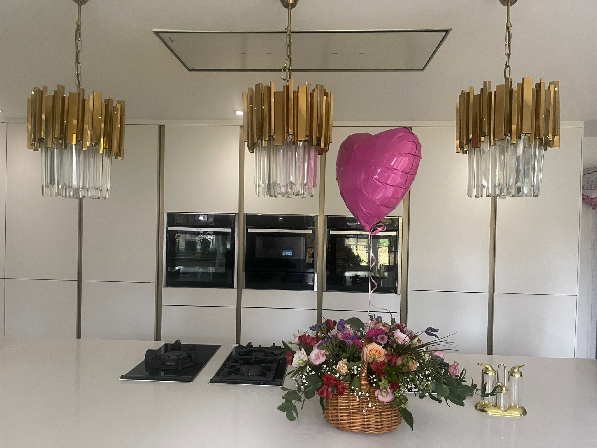Boeotia pendant lights above kitchen island seating area