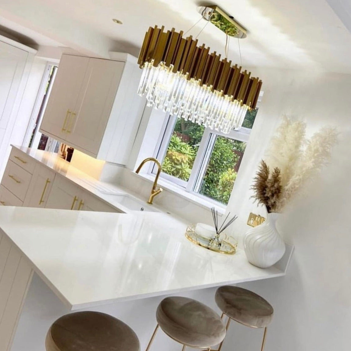 Boeotia gold and crystal chandelier above dining table