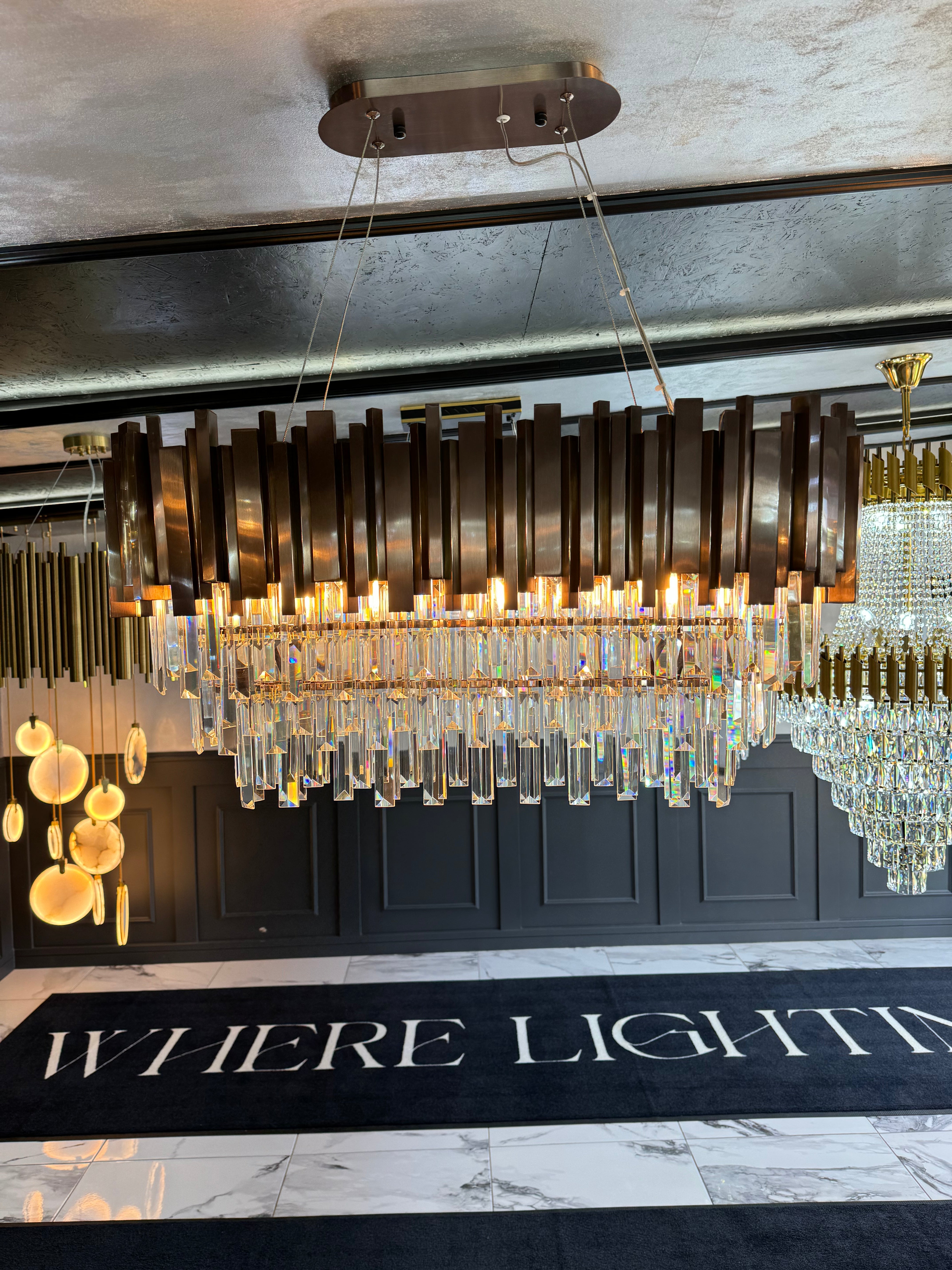 Boeotia gold and crystal rectangular chandelier illuminated indoors