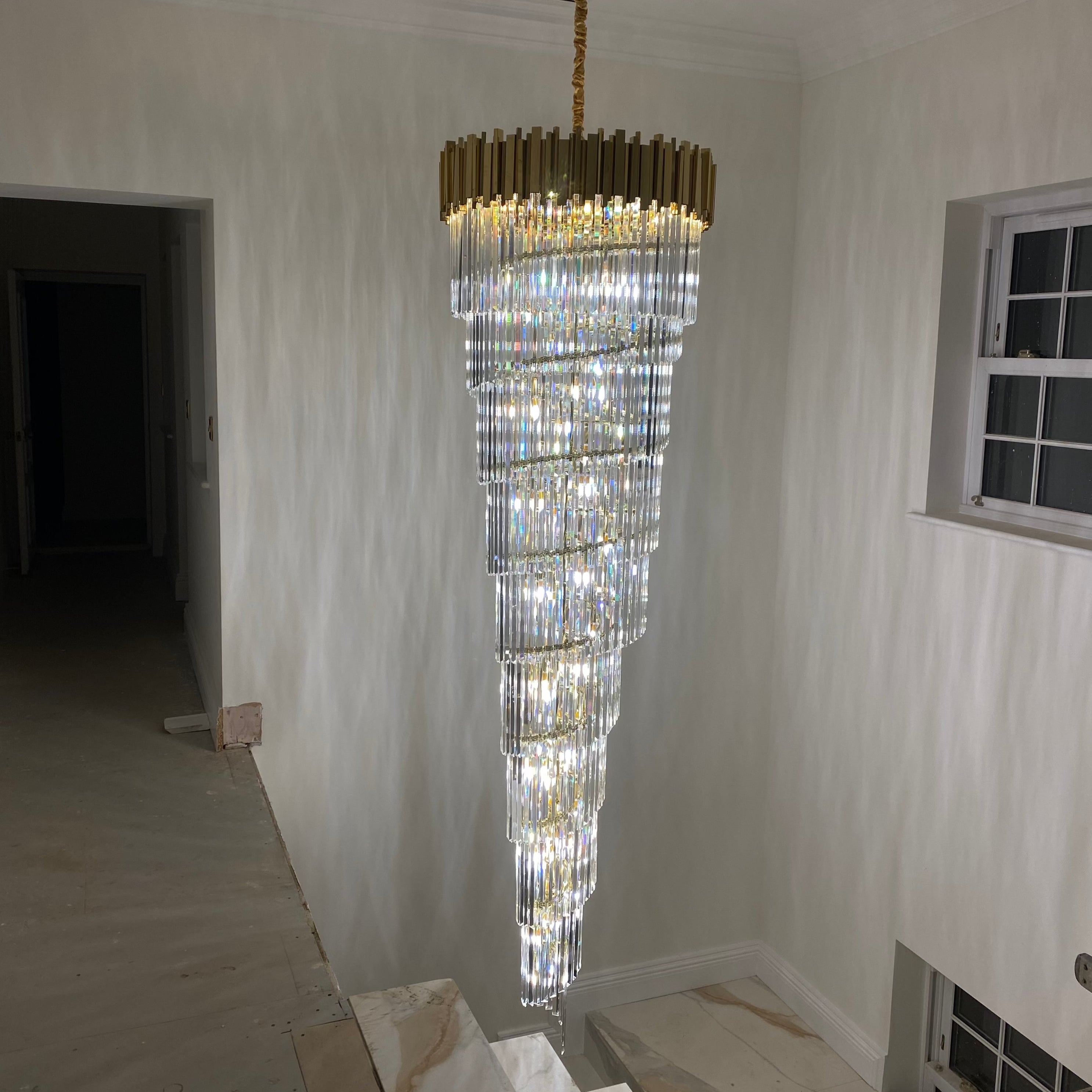 Boeotia spiral chandelier in modern white staircase interior