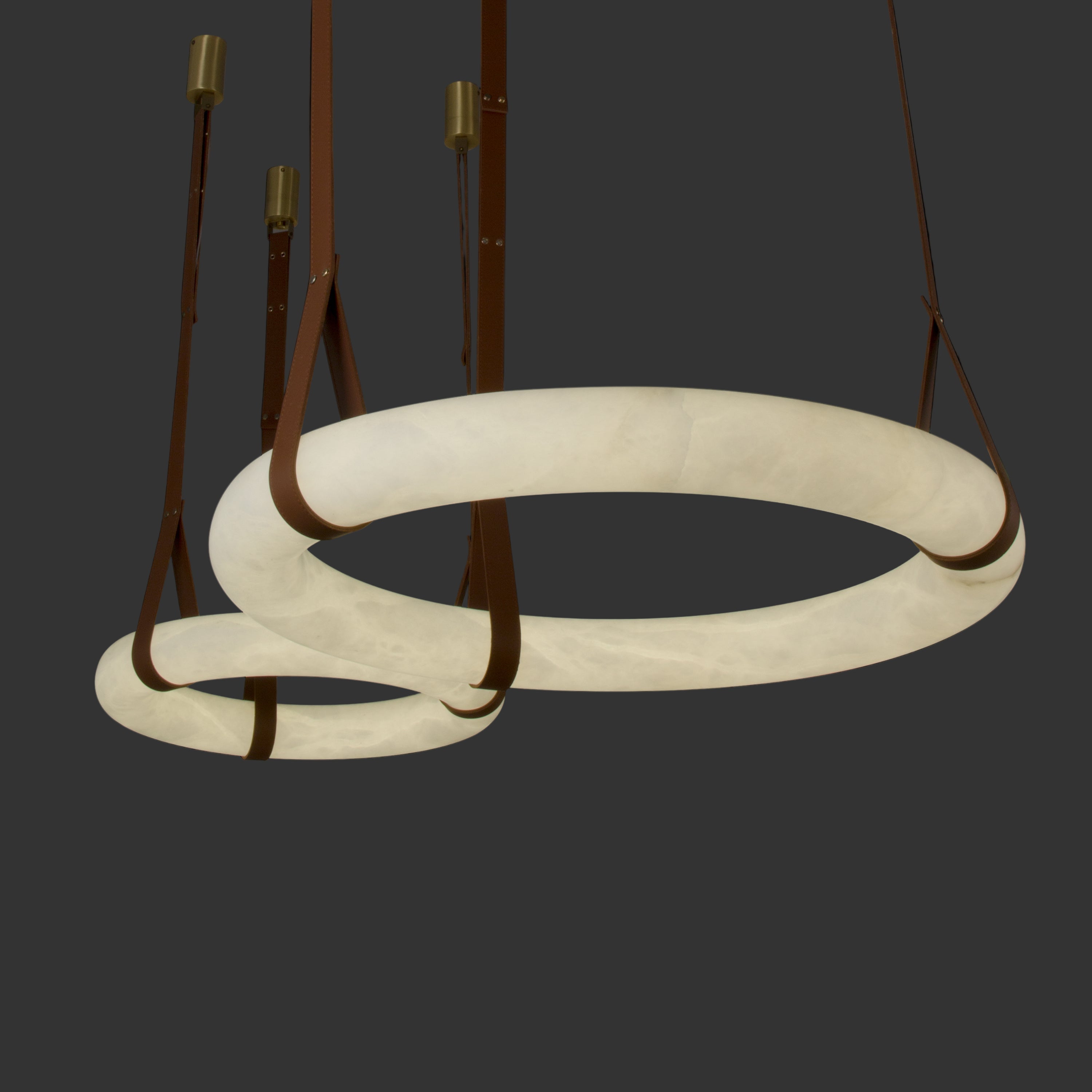 Angled view of illuminated Botticino marble ceiling light