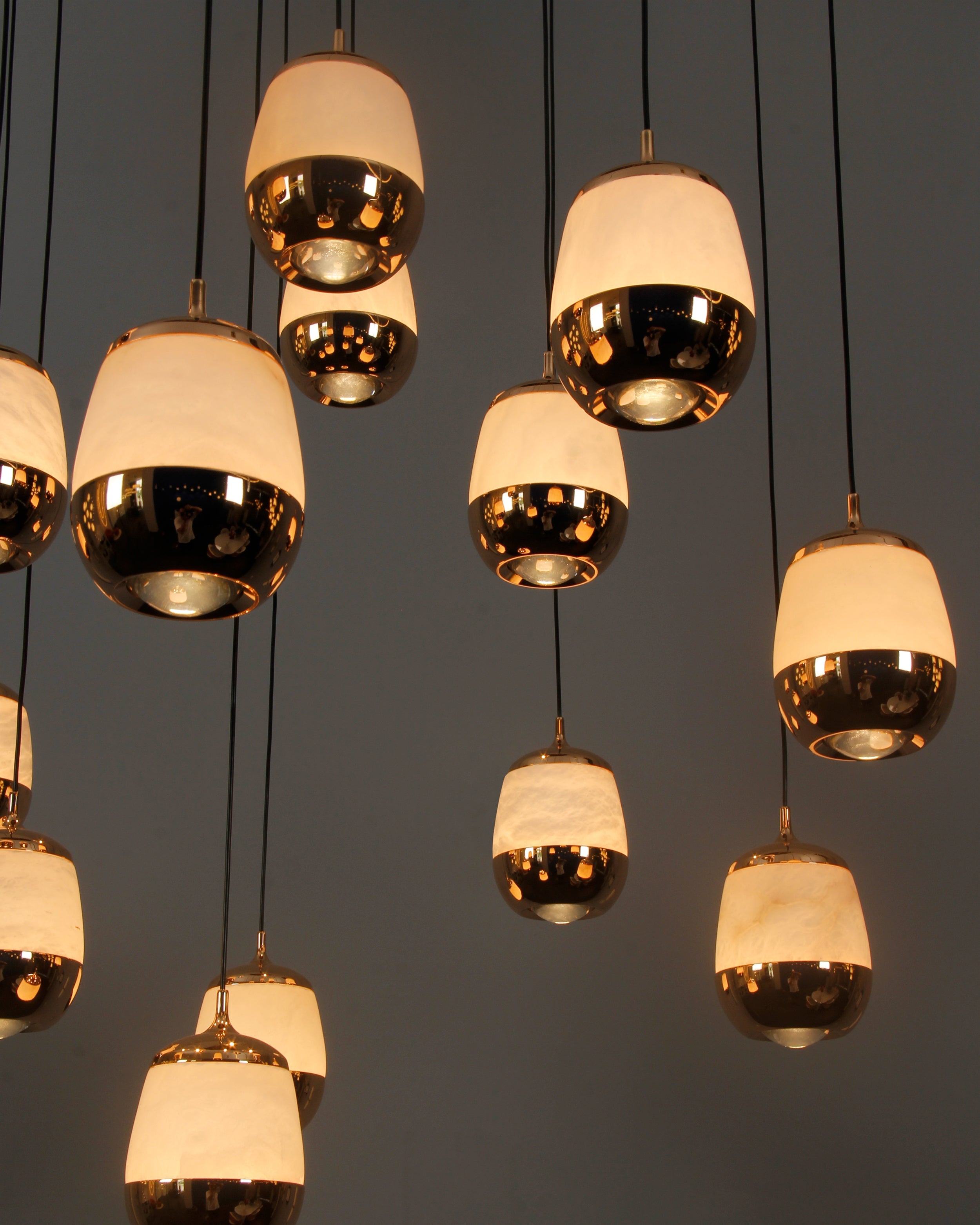 Close-up of marble pendant drops in cascading staircase chandelier