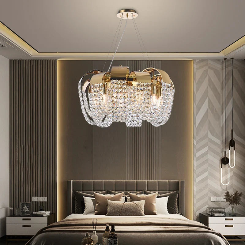 Circular crystal chandelier above bed in elegant interior