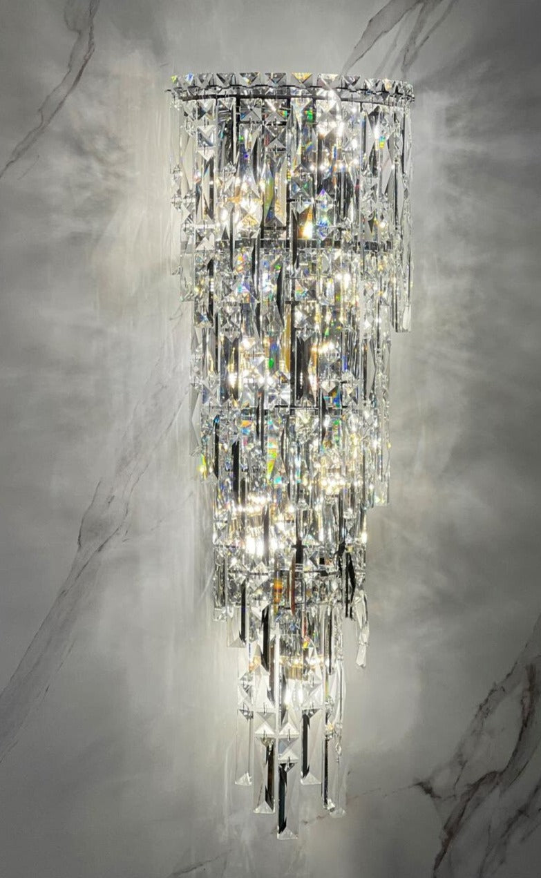 Crystal wall light installed in elegant UAE hallway with marble wall