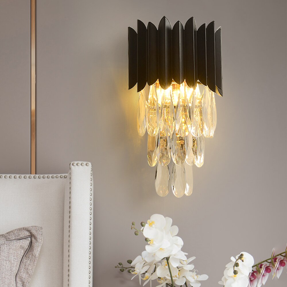 Doral Wall Light with diamond cut teardrop crystals illuminating a luxury interior