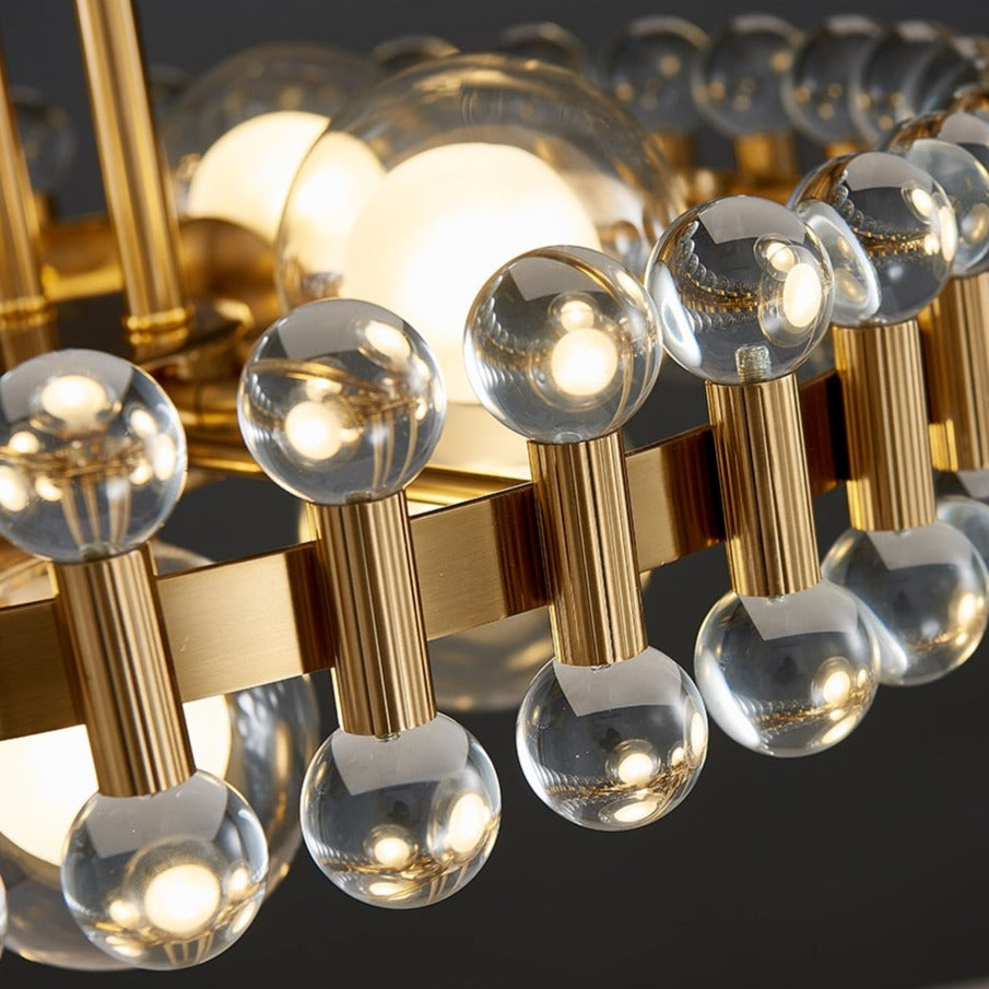 Glass sphere accents on Alytus gold circular pendant light UAE