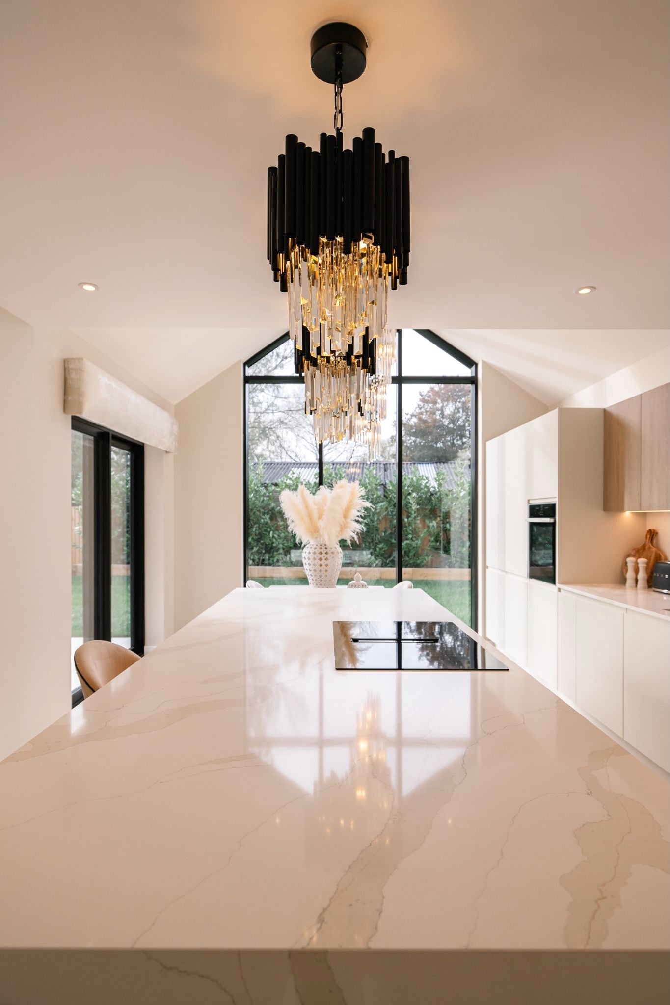 Gotham pendant lighting viewed through a contemporary kitchen space