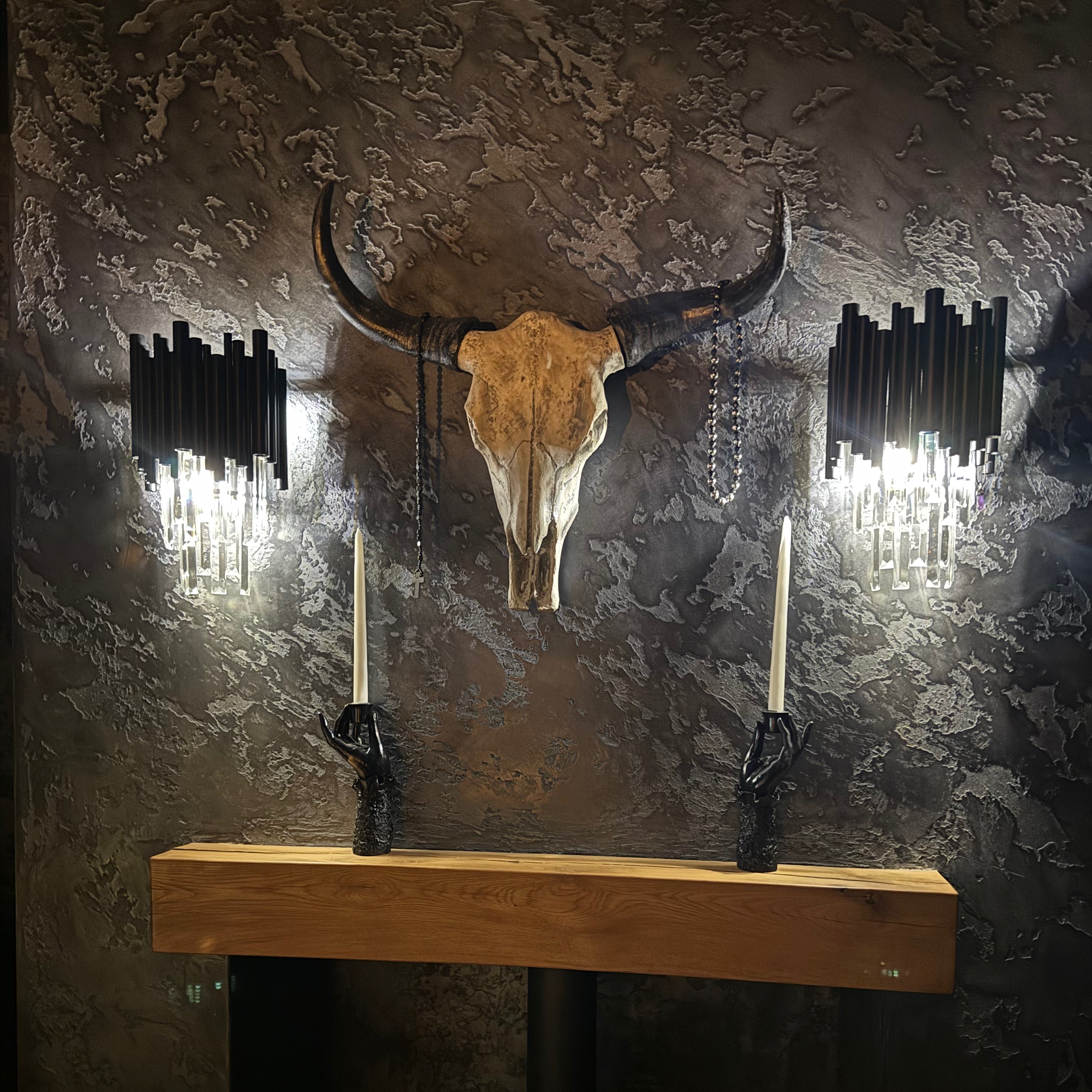 Gotham wall light with crystal bars creating dramatic ambient lighting in a luxury interior