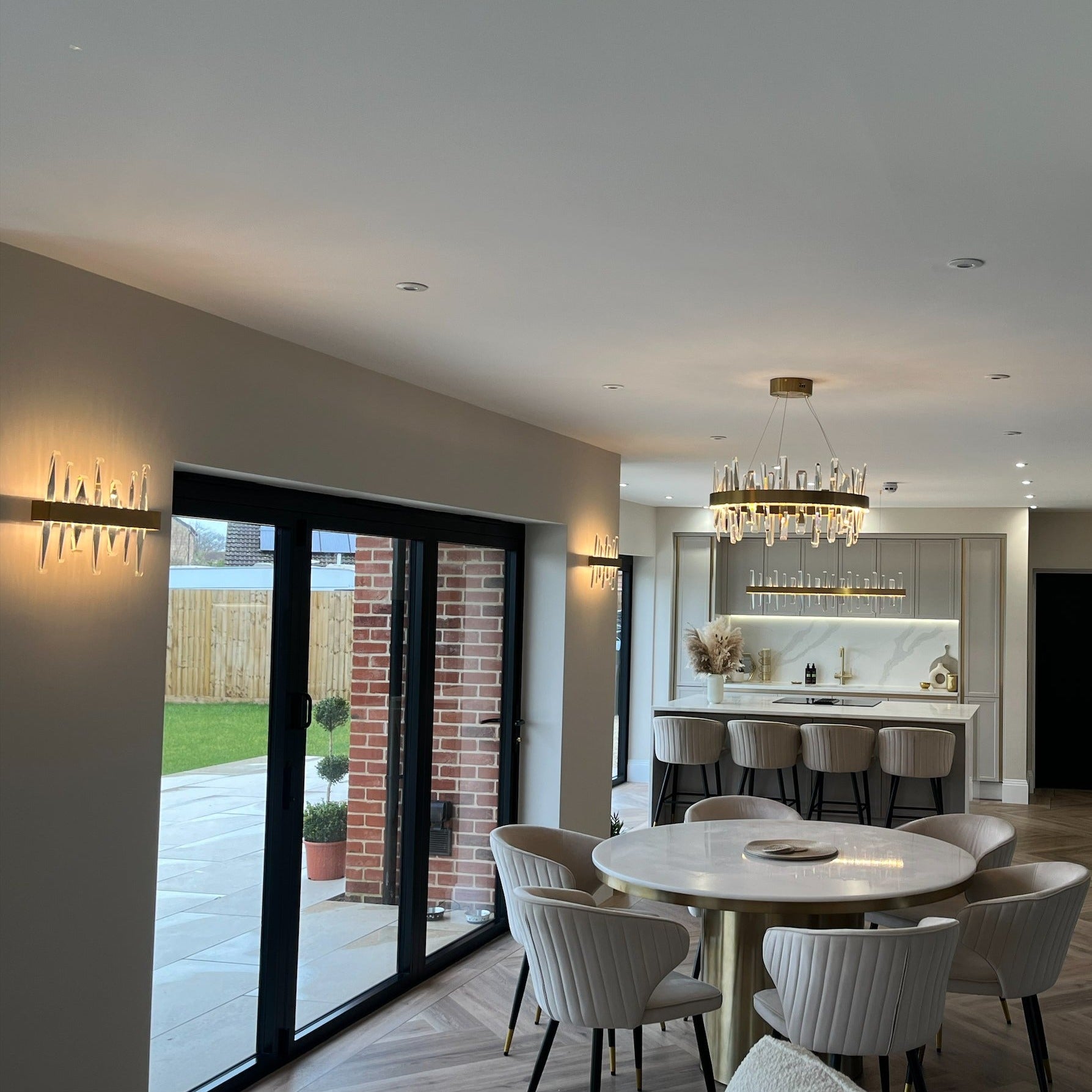 Grantchester Circular Chandelier illuminating an open-plan luxury interior setting