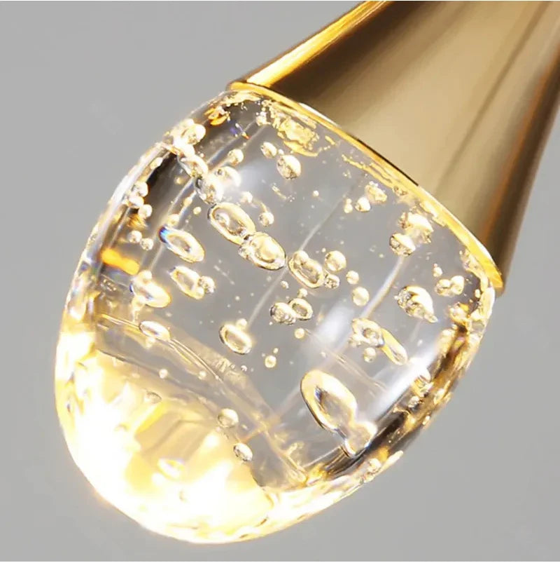 Close-up of illuminated bubble glass detail on the Henley Pendant
