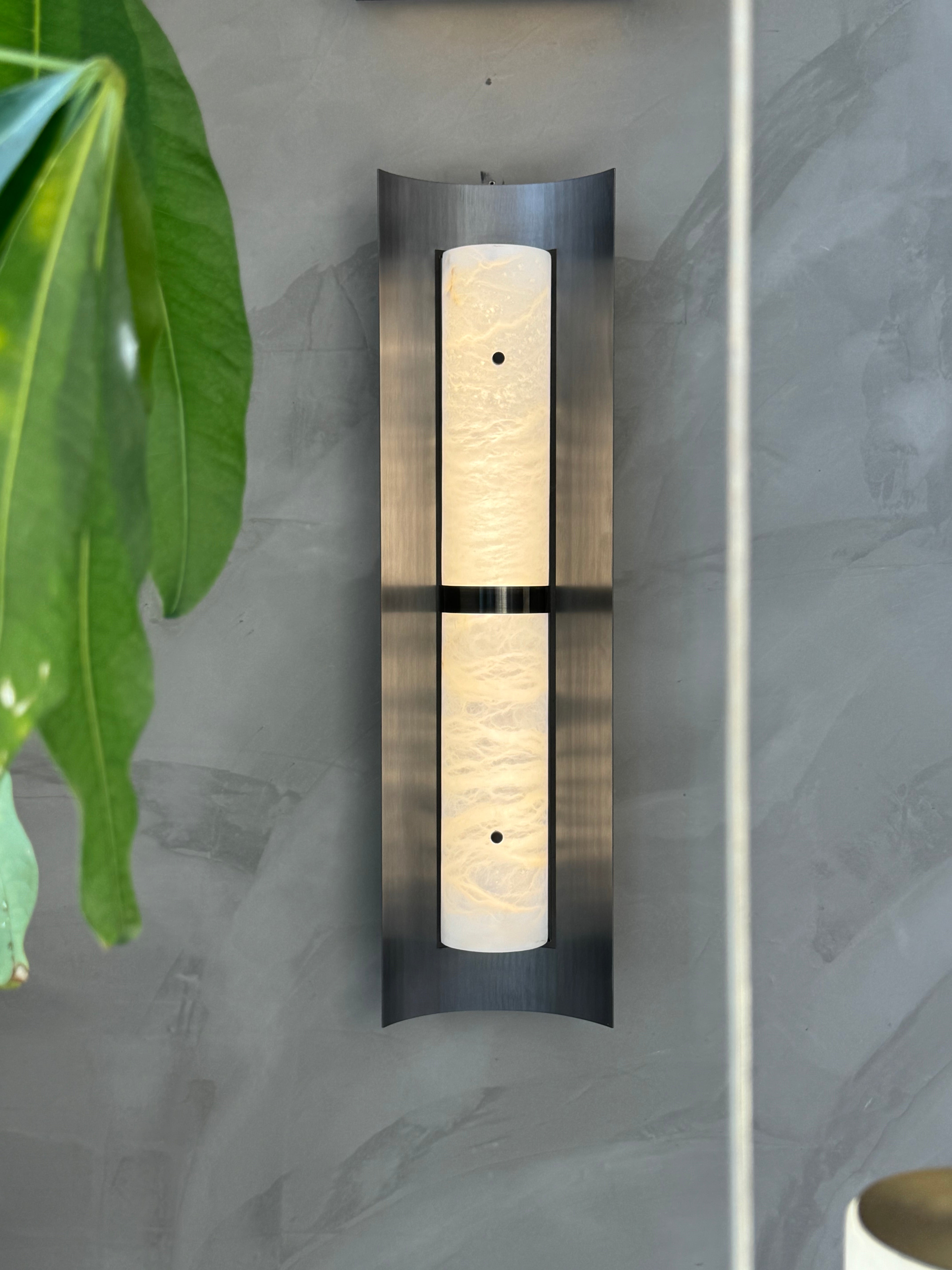 Hercules Marble Wall Light styled within a sophisticated modern living space