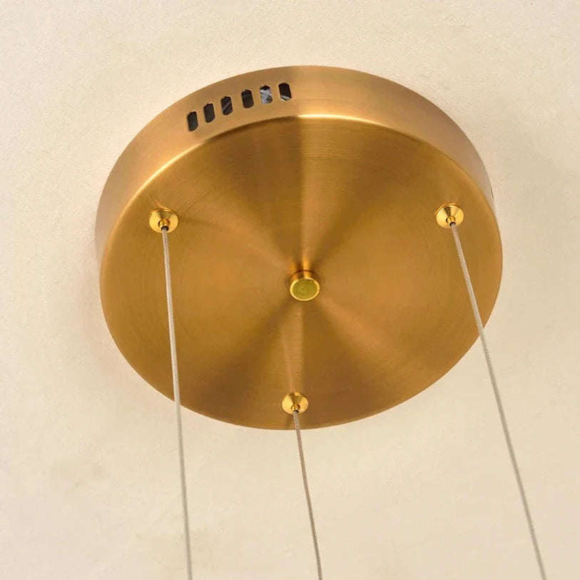 Hex Trio Circular Chandelier ceiling plate detail illustrating clean suspension design for modern luxury interiors