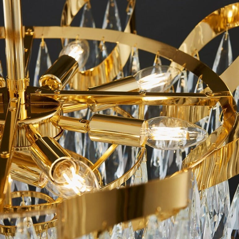 Isso Circular Chandelier showing curved sculptural frame with cascading diamond cut crystal drops