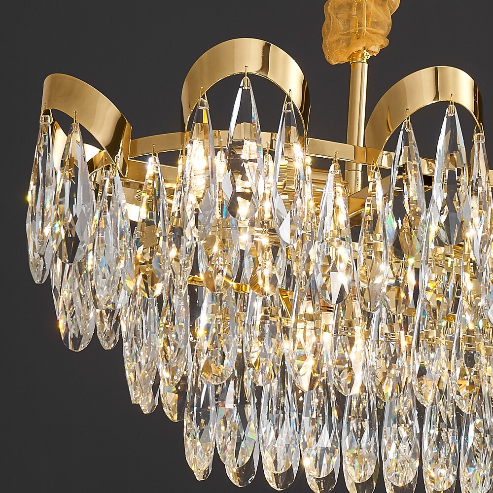 Close up of Isso Rectangular Chandelier diamond cut teardrop crystal drops and sculptural frame