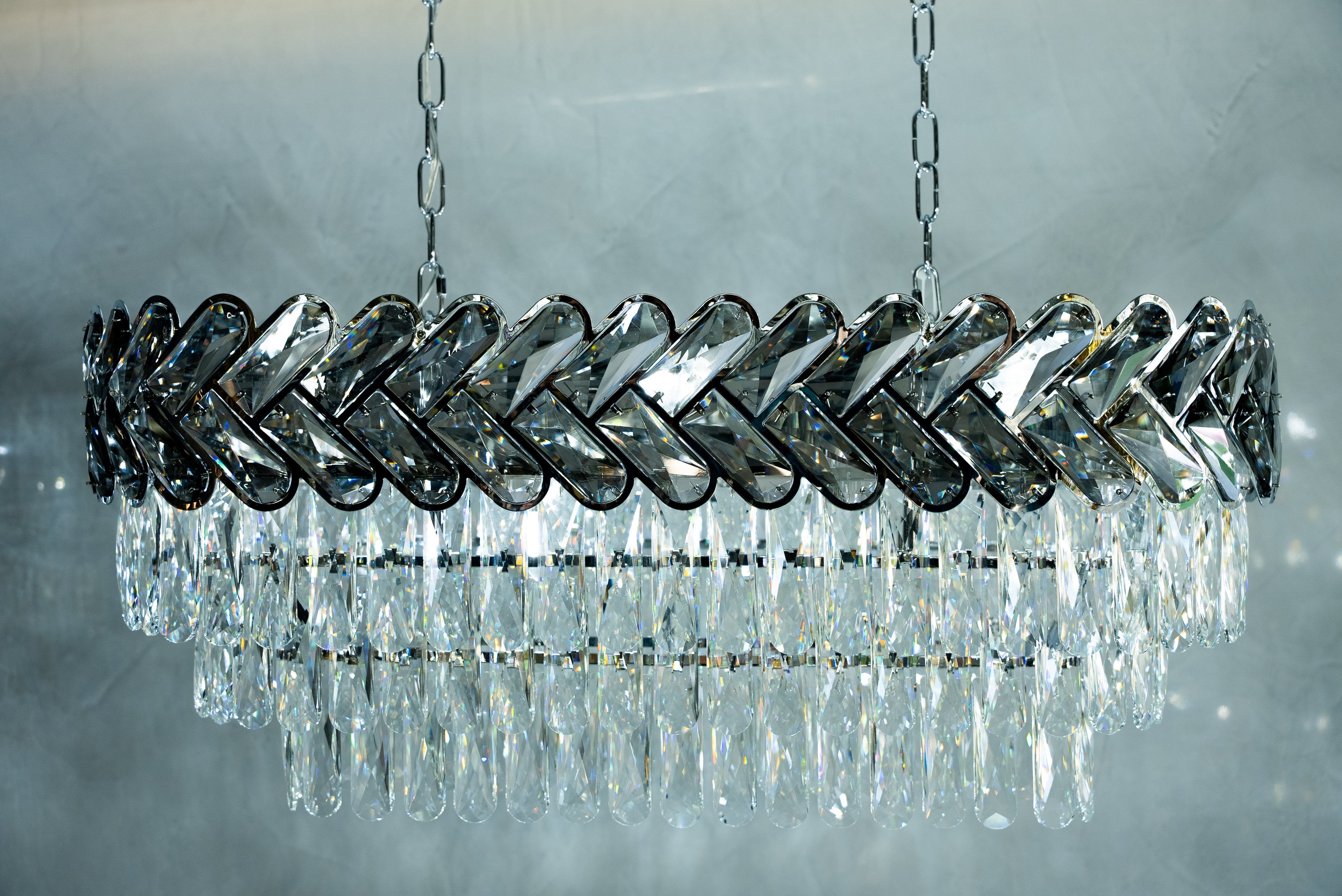 Linear crystal chandelier with chevron arrangement and contemporary luxury styling