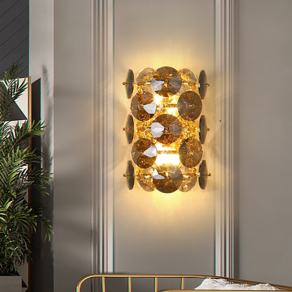 Lorenzo wall light with clear and smoky grey diamond cut crystal discs illuminating a luxury interior wall