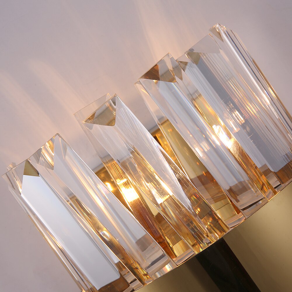 Close-up of angled crystal bars and polished metal frame on the Malahide wall light